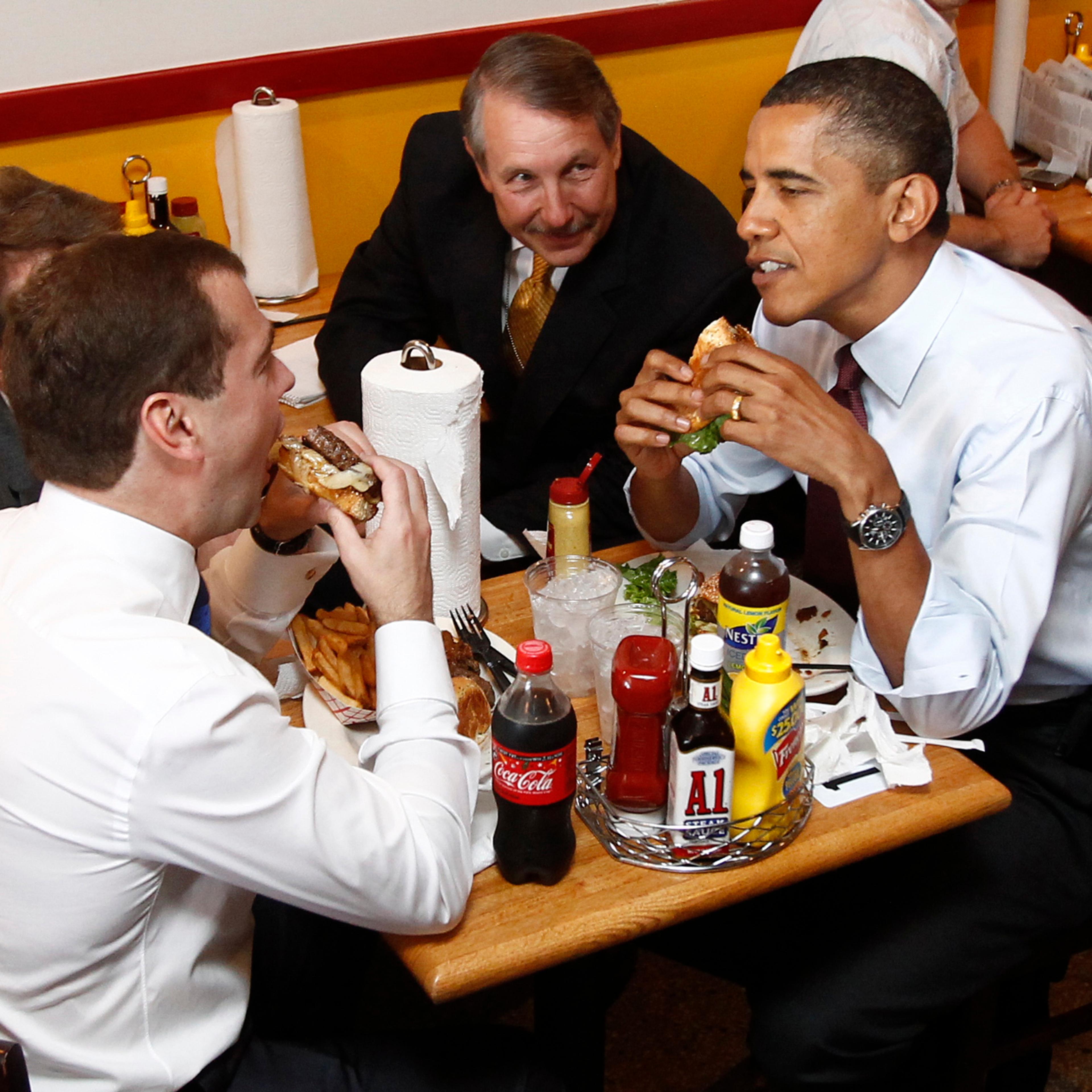 Barack Obama and Russia's President Dmitry Medvedev have burgers at Ray's Hell Burger restaurant in Arlington, Virginia, June 24, 2010.