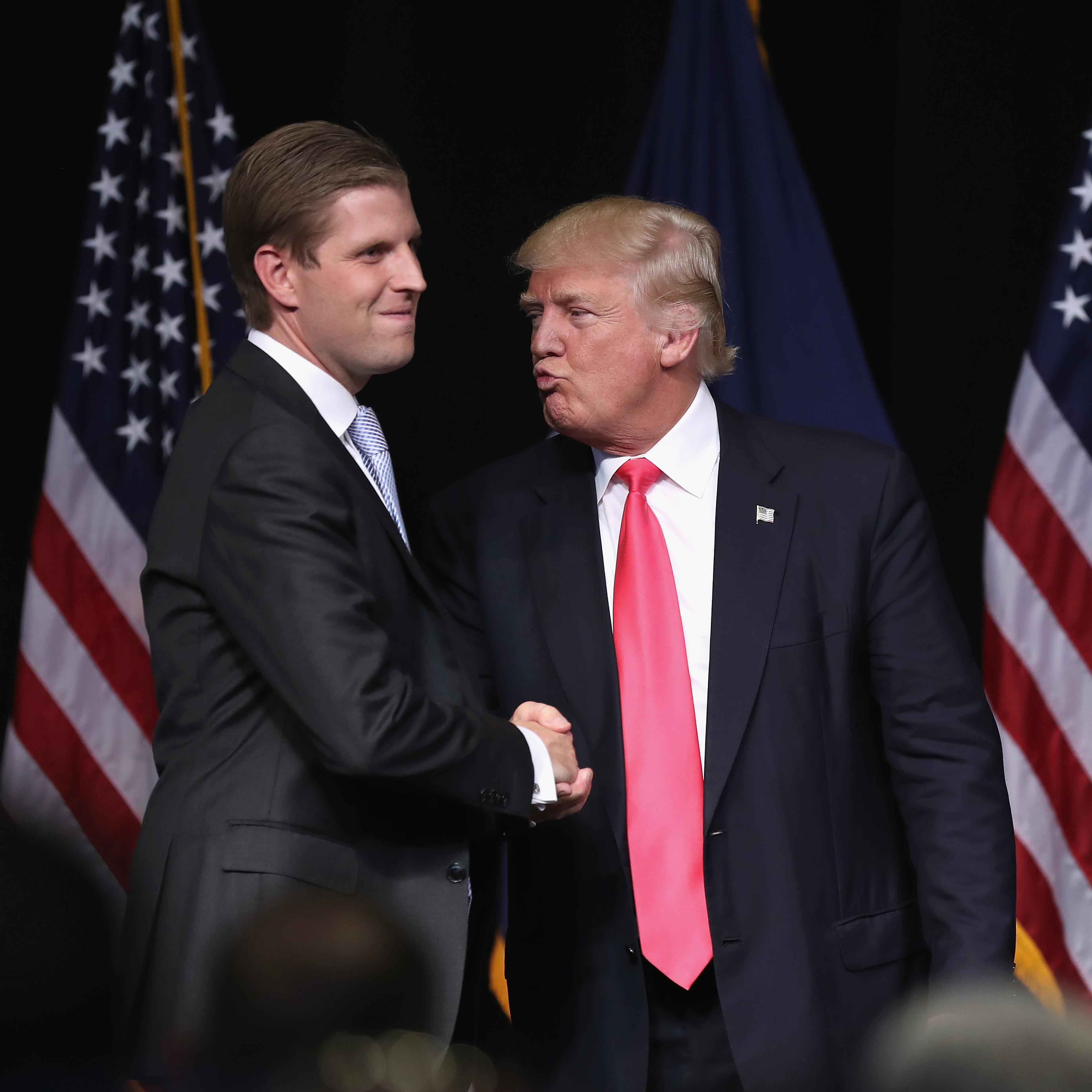 Republican Presidential candidate Donald Trump gives an "air kiss" to his son Eric Trump at a campaign rally in Scranton, Penn., on July 27, 2016.