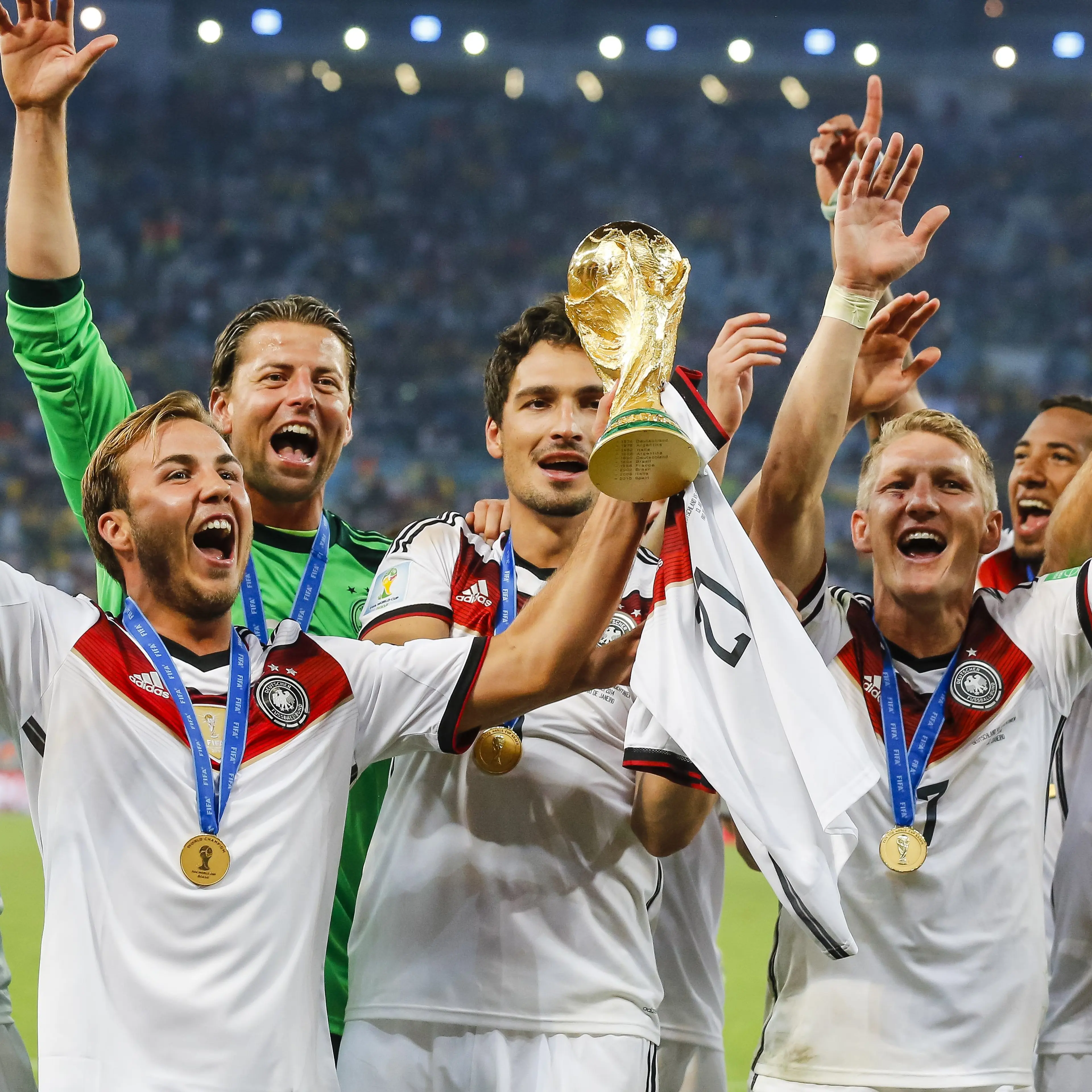 Mario Goetze of Germany holds the World Cup trophy after winning the FIFA World Cup 2014 final soccer match between Germany and Argentina at the Estadio do Maracana in Rio de Janeiro on July 13, 2014.