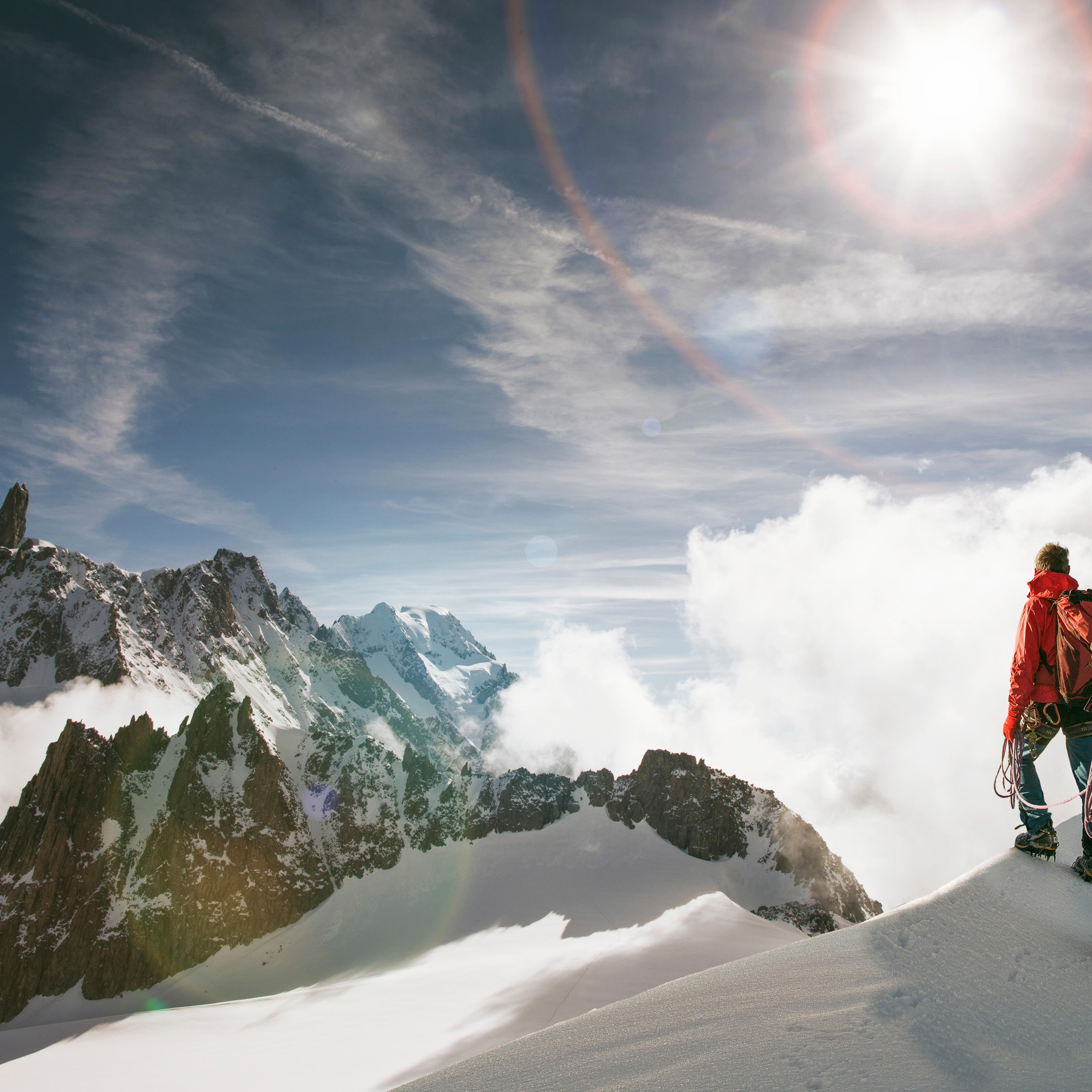 Caucasian hikers standing on snowy mountain top, Mont Blanc, Alps, France