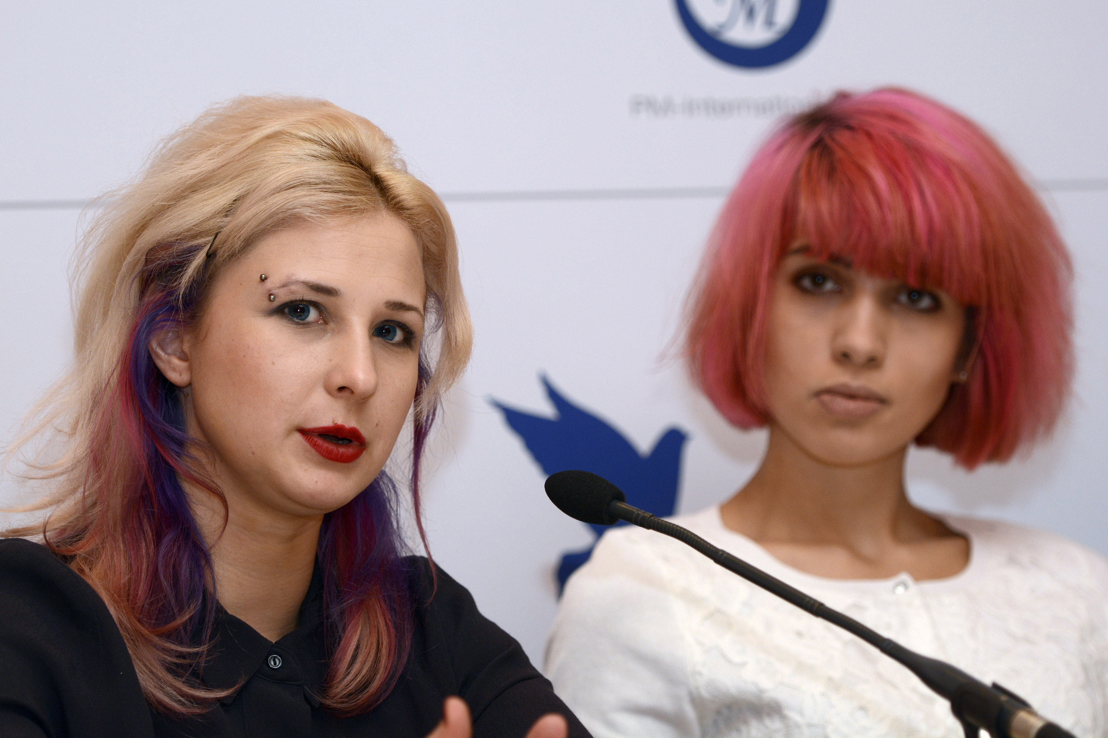 Maria Alekhina (L) and Nadezhda Tolokonnikova (R) of Russian punk band Pussy Riot during Cinema for Peace Berlin 2015 press conference in Berlin, Germany on Feb. 9, 2015.