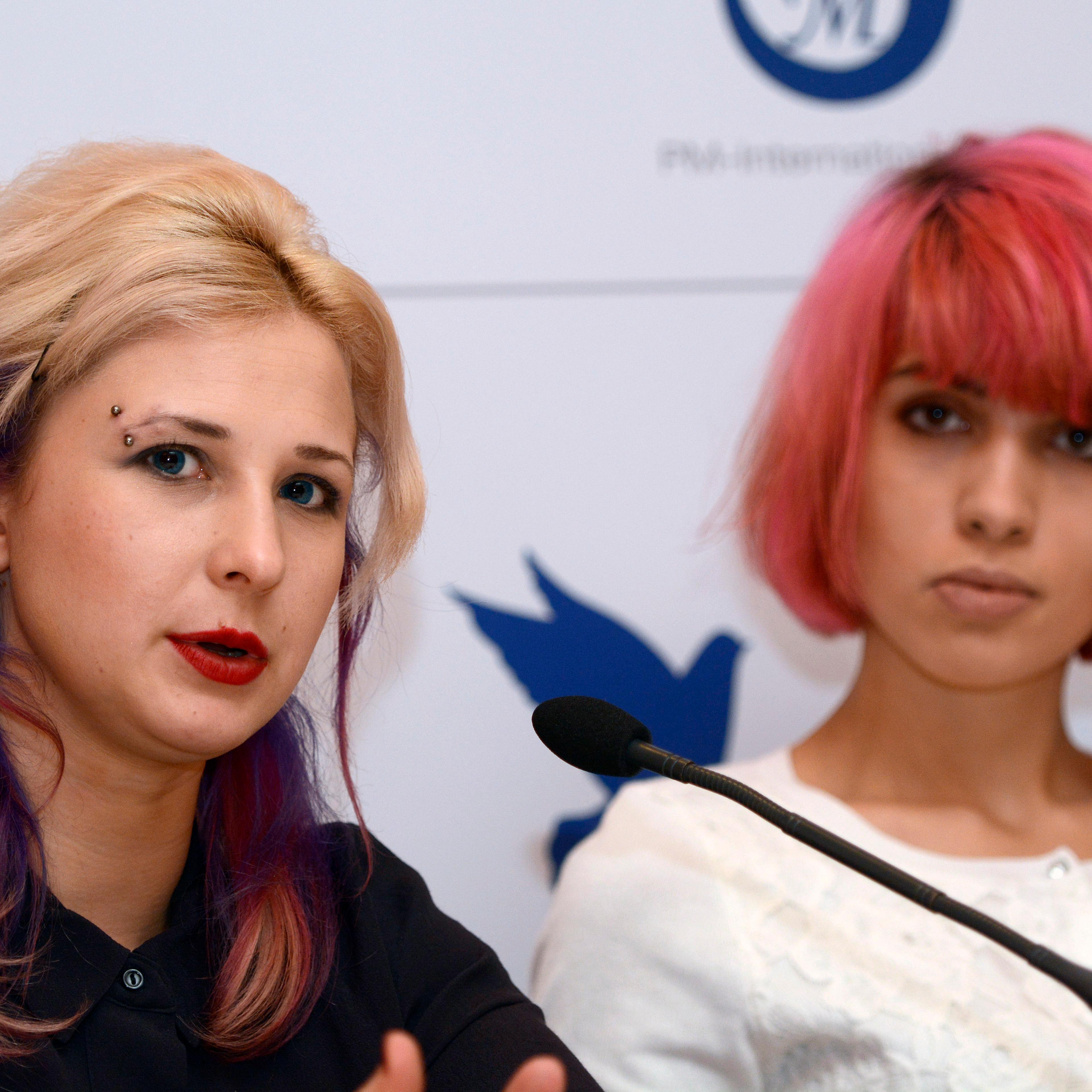 Maria Alekhina (L) and Nadezhda Tolokonnikova (R) of Russian punk band Pussy Riot during Cinema for Peace Berlin 2015 press conference in Berlin, Germany on Feb. 9, 2015.