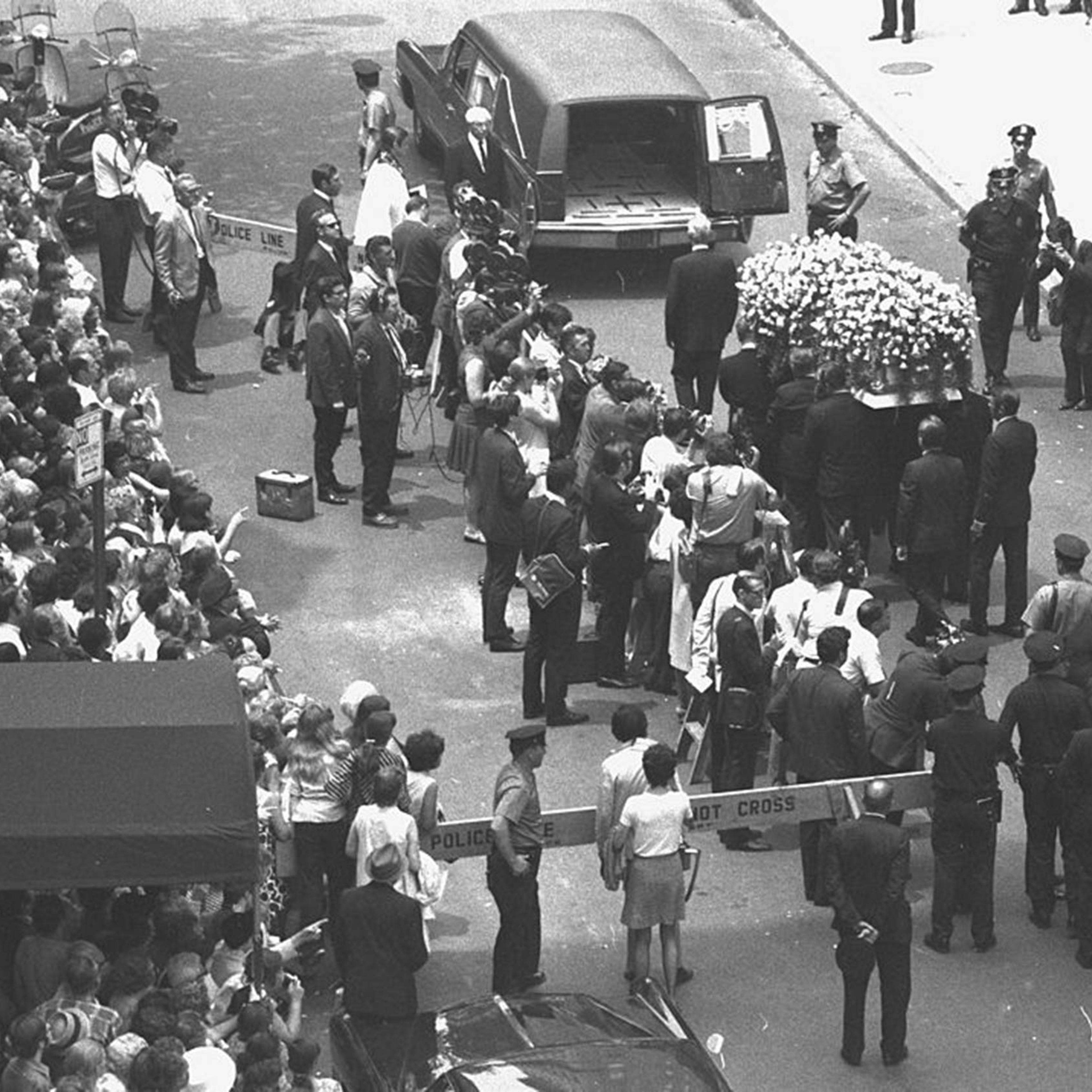 Yellow roses cover Judy Garland's coffin as it is taken to hearse at Campbell Funeral Home on June 27, 1969.