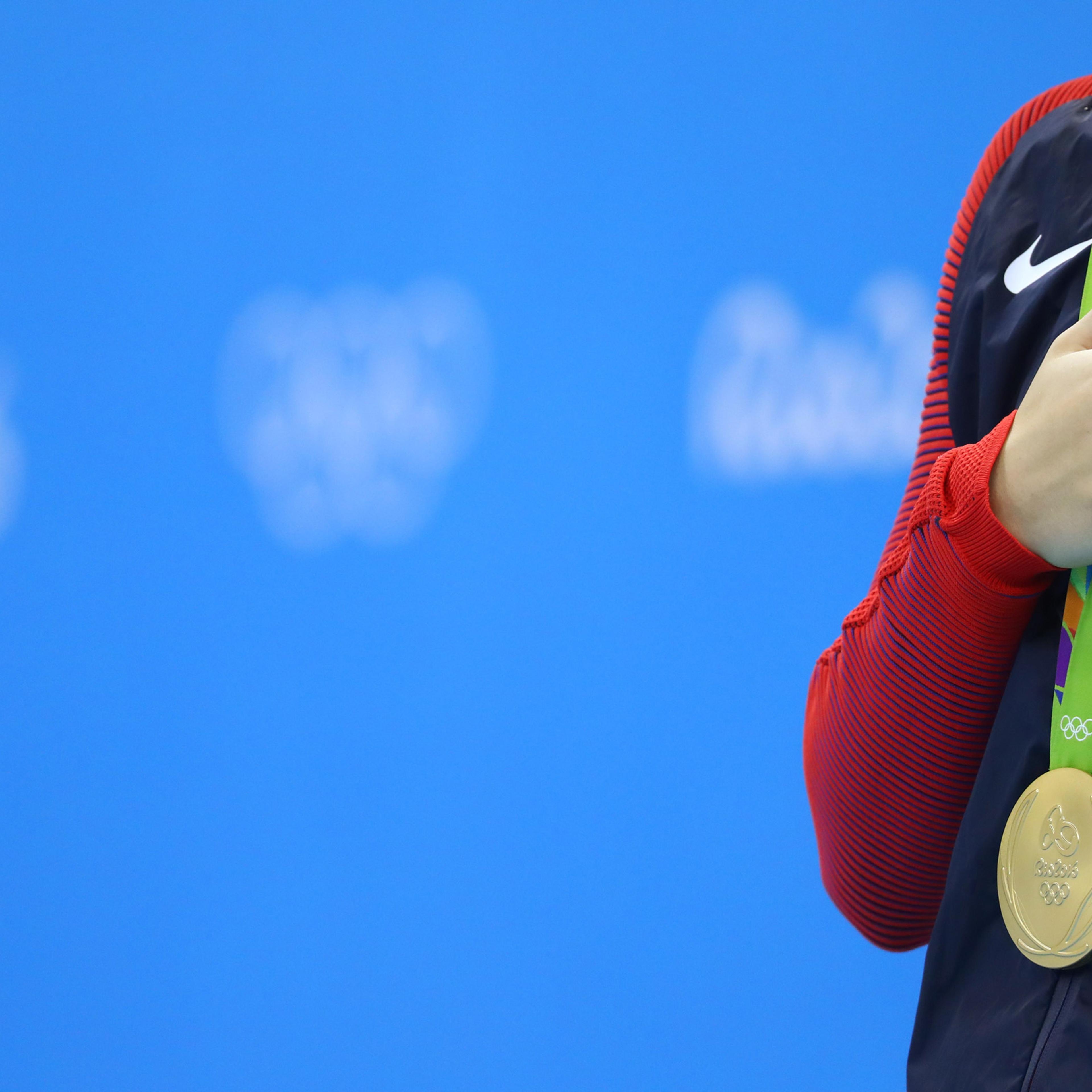 2016 Rio Olympics - Swimming - Victory Ceremony - Women's 200m Freestyle Victory Ceremony - Olympic Aquatics Stadium - Rio de Janeiro, Brazil - 09/08/2016. Katie Ledecky (USA) of USA stands to attention during the national anthem after winning the gold m