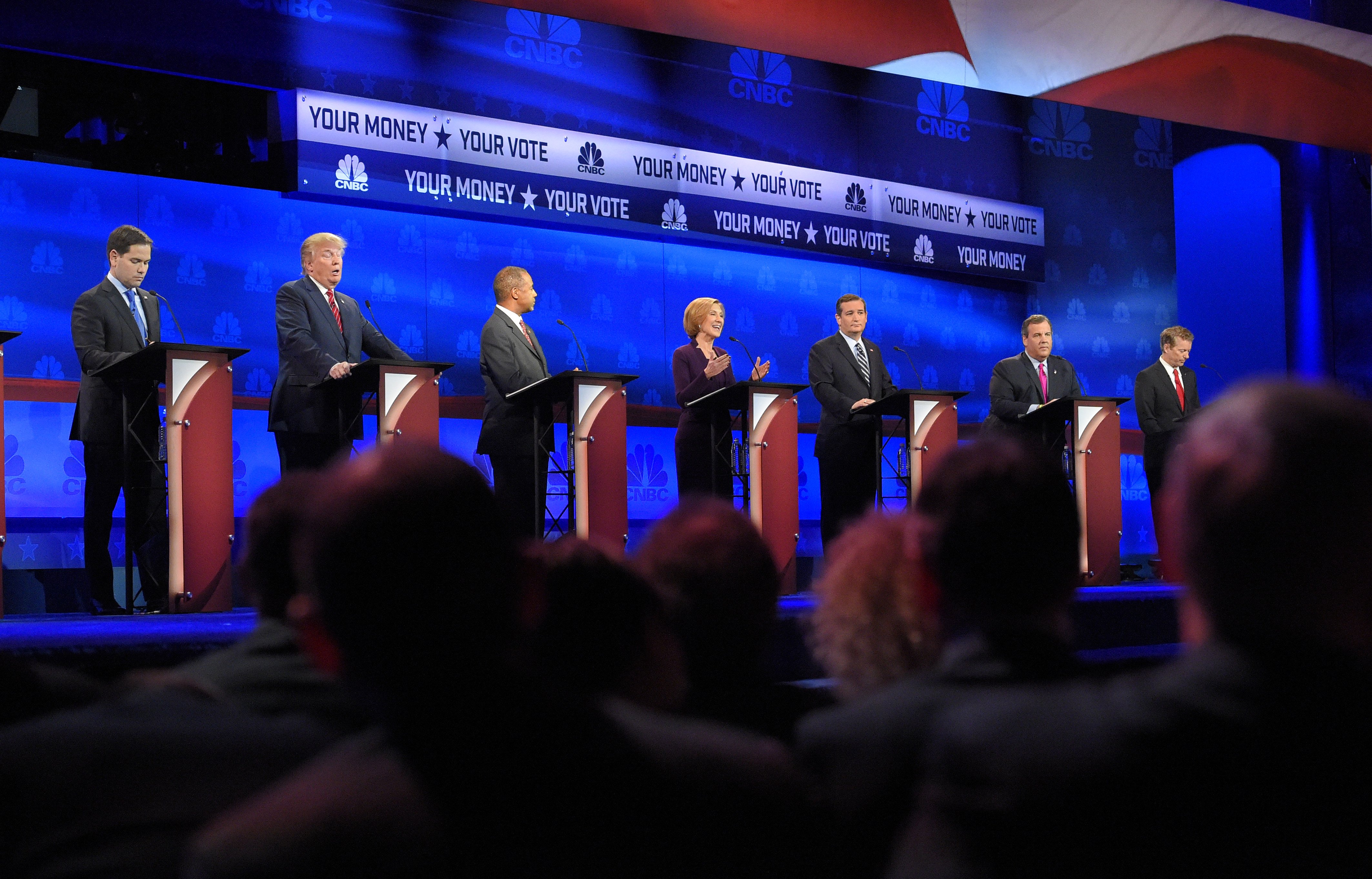 Republican presidential candidates, from left, Marco Rubio, Donald Trump, Ben Carson, Carly Fiorina, Ted Cruz, Chris Christie, and Rand Paul take the stage during the CNBC Republican presidential debate at the University of Colorado on Oct. 28, 2015, in 