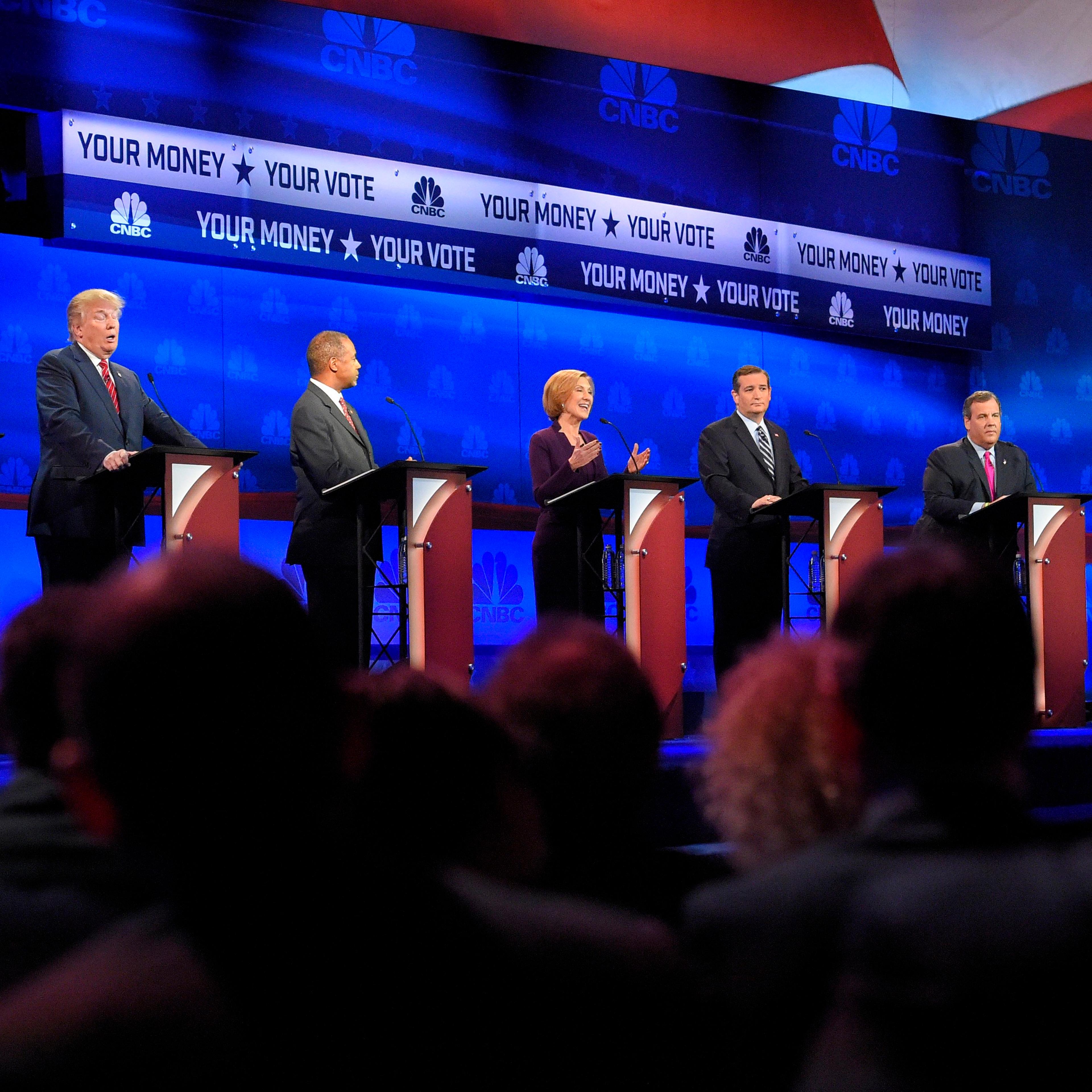 Republican presidential candidates, from left, Marco Rubio, Donald Trump, Ben Carson, Carly Fiorina, Ted Cruz, Chris Christie, and Rand Paul take the stage during the CNBC Republican presidential debate at the University of Colorado on Oct. 28, 2015, in