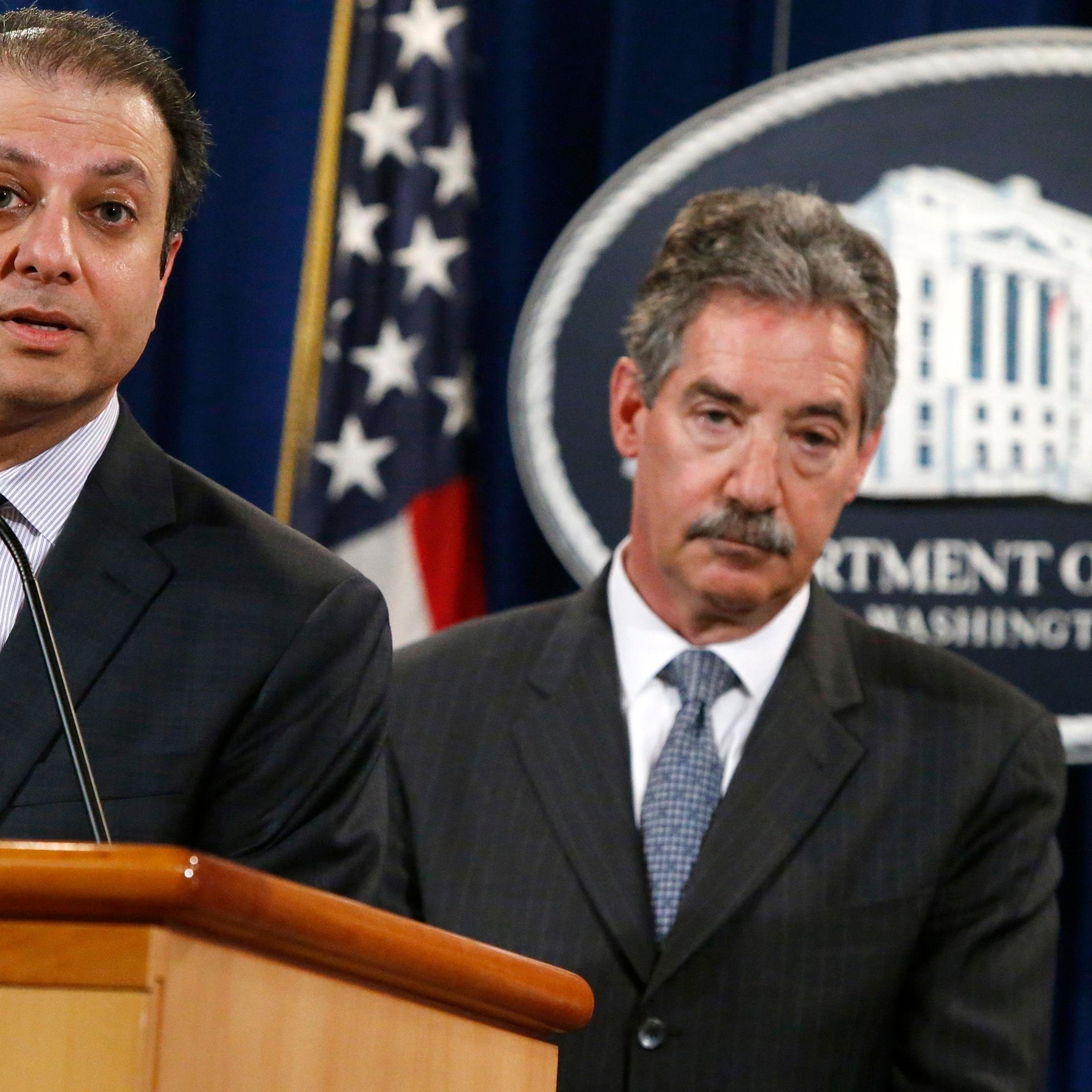 U.S. Attorney for the Southern District of New York Bharara speaks while flanked by U.S. Deputy Attorney General Cole as they announce a settlement with Anadarko Petroleum Corp in Washington