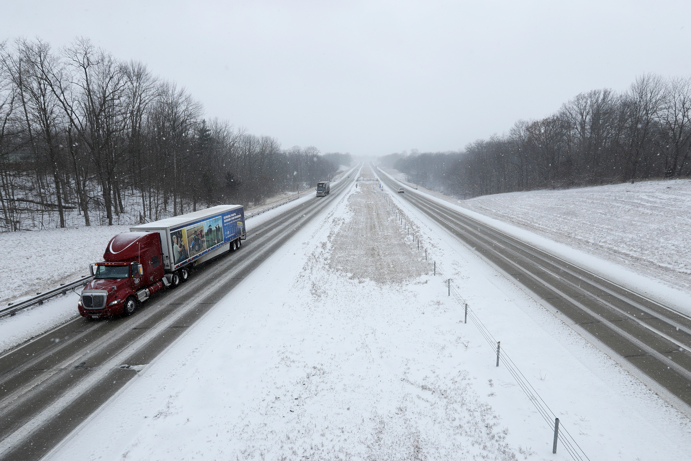 Motorist drive along Interstate 65 near Zionsville, Ind