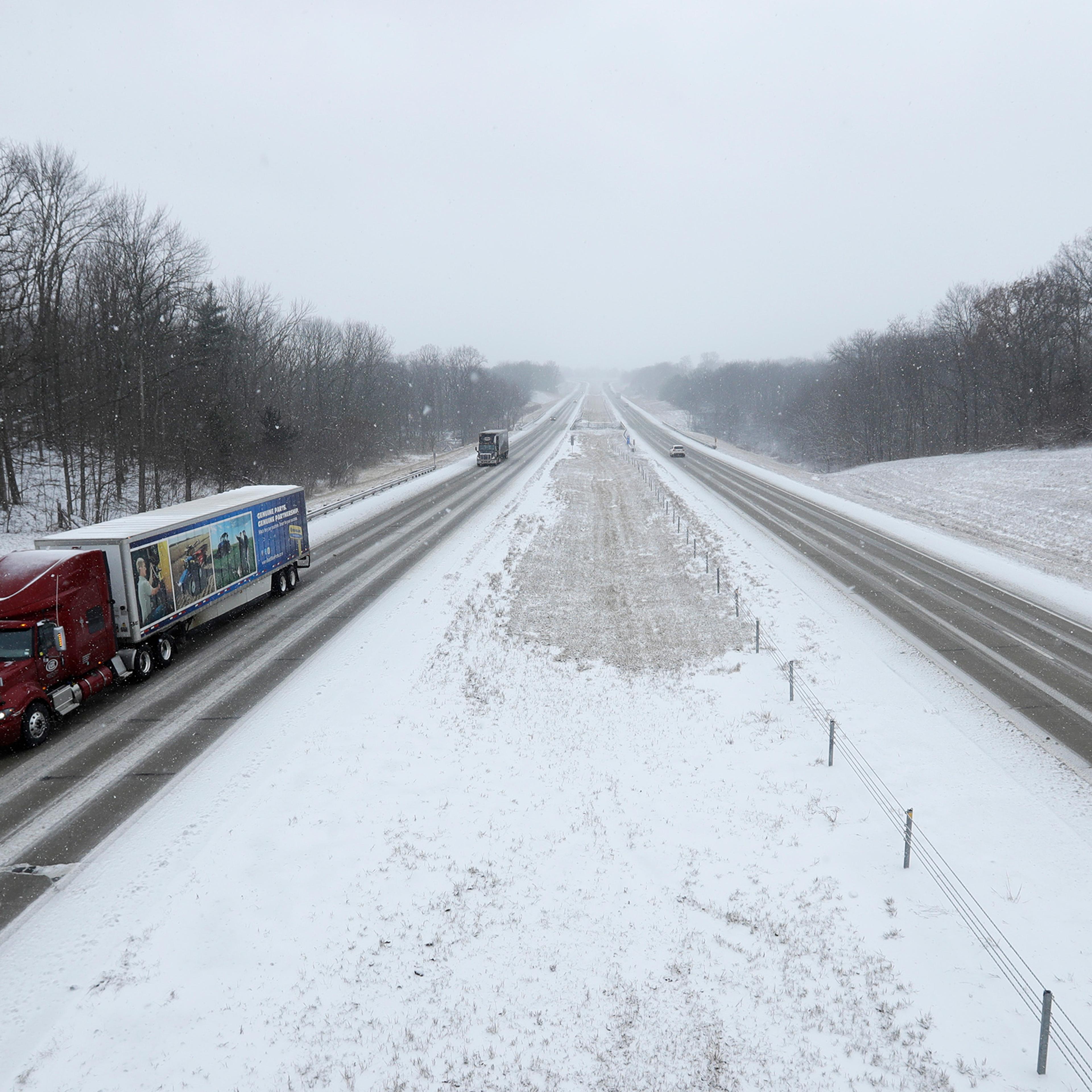 Motorist drive along Interstate 65 near Zionsville, Ind