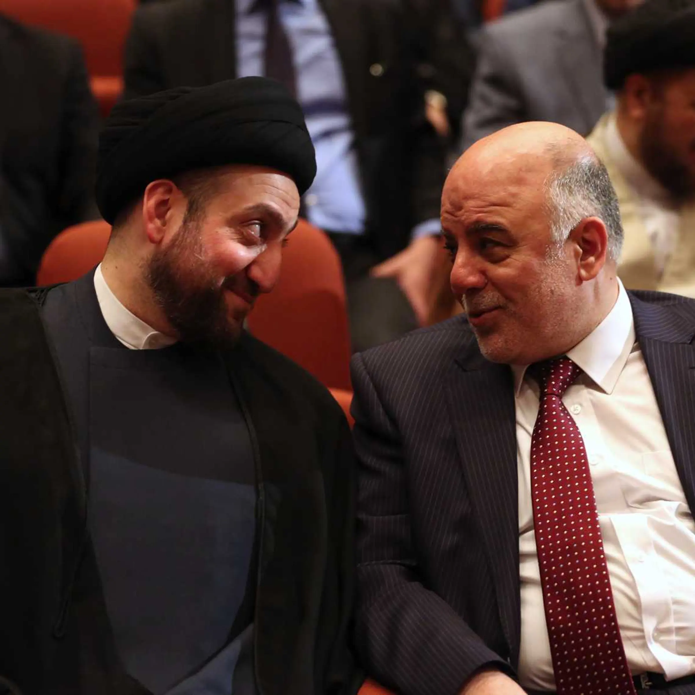 Iraq's new Prime Minister Haider al-Abadi, right, and Ammar al-Hakim, left, the leader of the Supreme Islamic Council of Iraq, during the session to approve the new government in Baghdad on Sept. 8, 2014