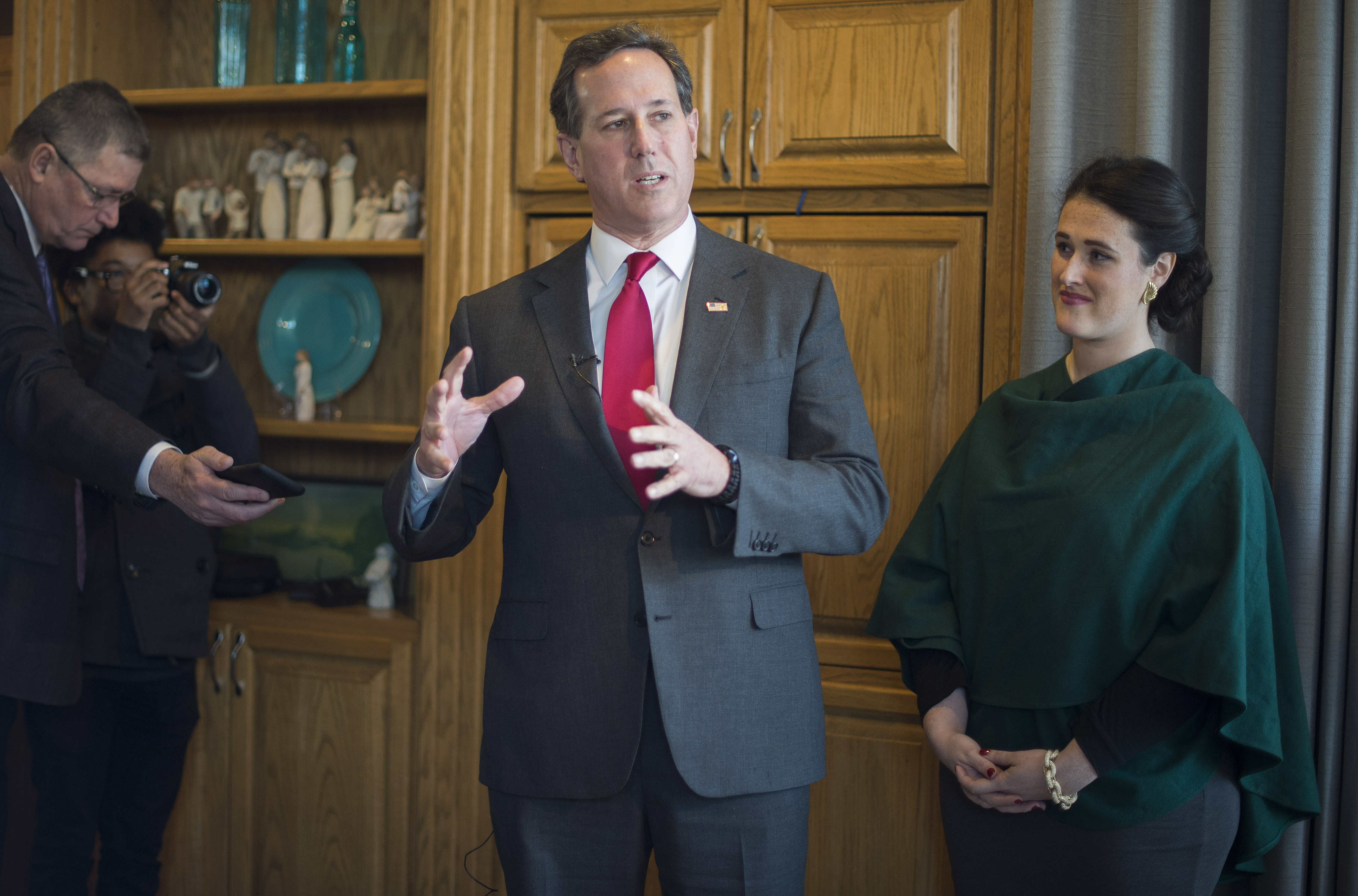 Republican presidential candidate Rick Santorum speaks beside daughter Elizabeth during a campaign stop at a private residence in West Des Moines, Iowa, on Jan. 31, 2016, ahead of the Iowa Caucus.
