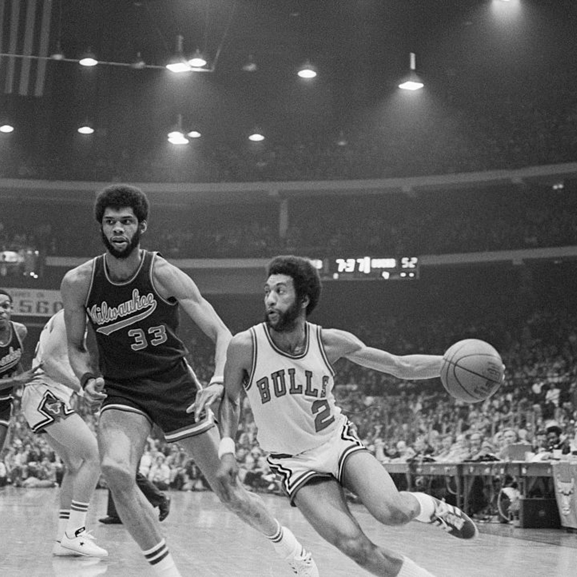 Norm Van Lier Driving Past Kareem Abdul-Jabbar