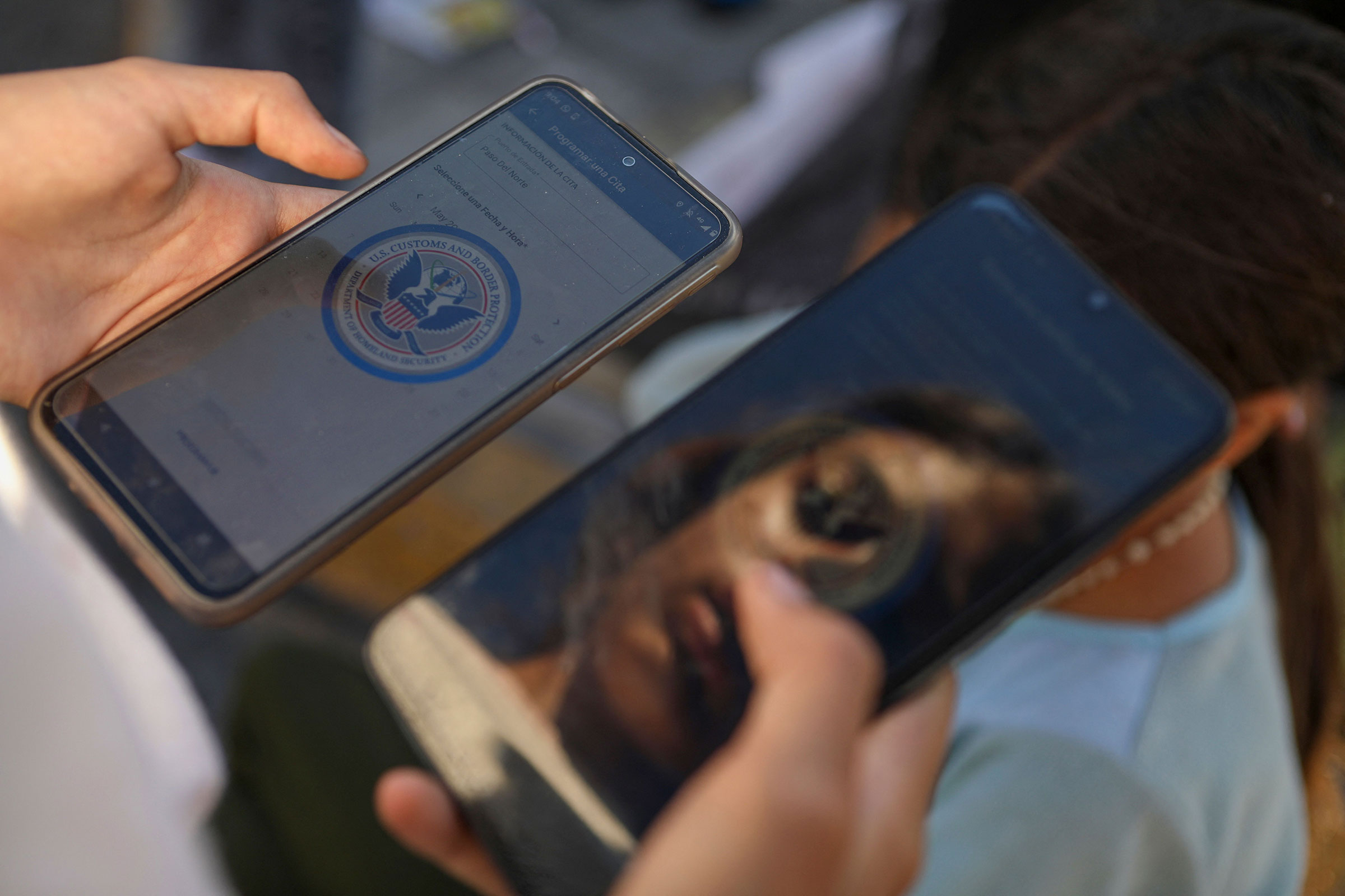 A Venezuelan migrant browses the CBP One mobile app searching for an appointment to enter the United States outside the temporary stay of the National Migration Institute (INM) in Ciudad Juarez, Chihuahua state, Mexico, on May 5, 2023.