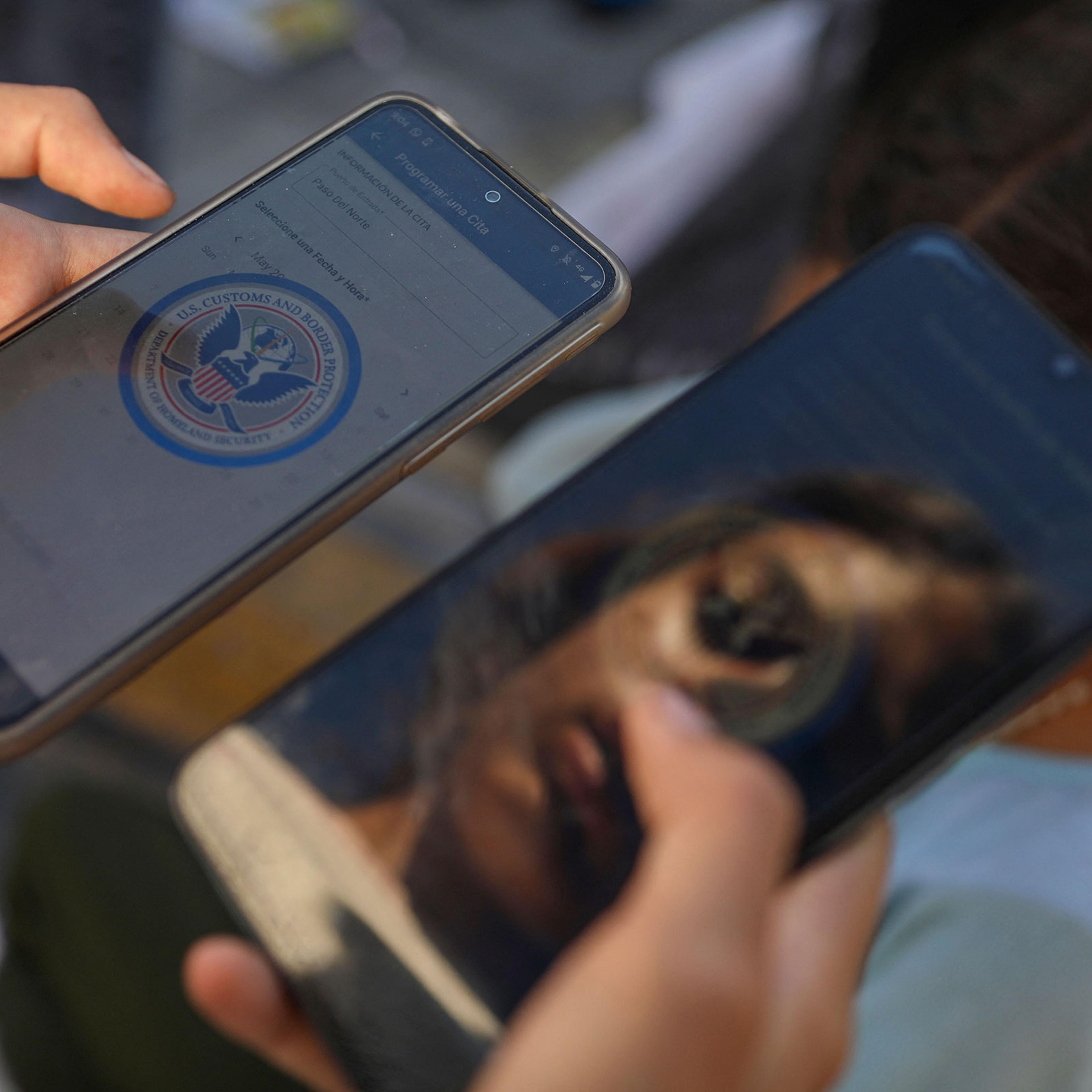 A Venezuelan migrant browses the CBP One mobile app searching for an appointment to enter the United States outside the temporary stay of the National Migration Institute (INM) in Ciudad Juarez, Chihuahua state, Mexico, on May 5, 2023.