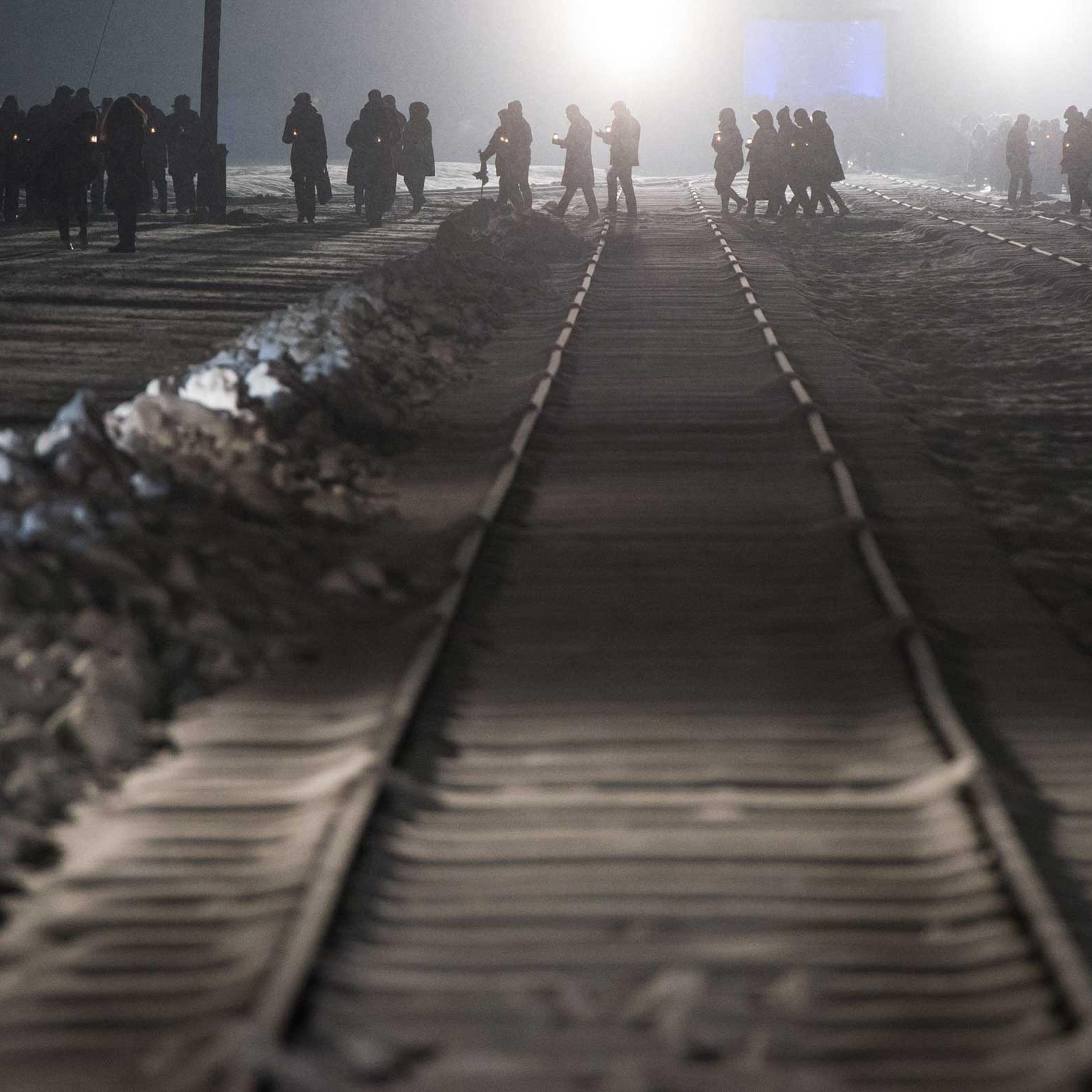 Auschwitz survivors and families visit the Birkenau Memorial carrying candles on Jan. 27, 2015 in Oswiecim, Poland.