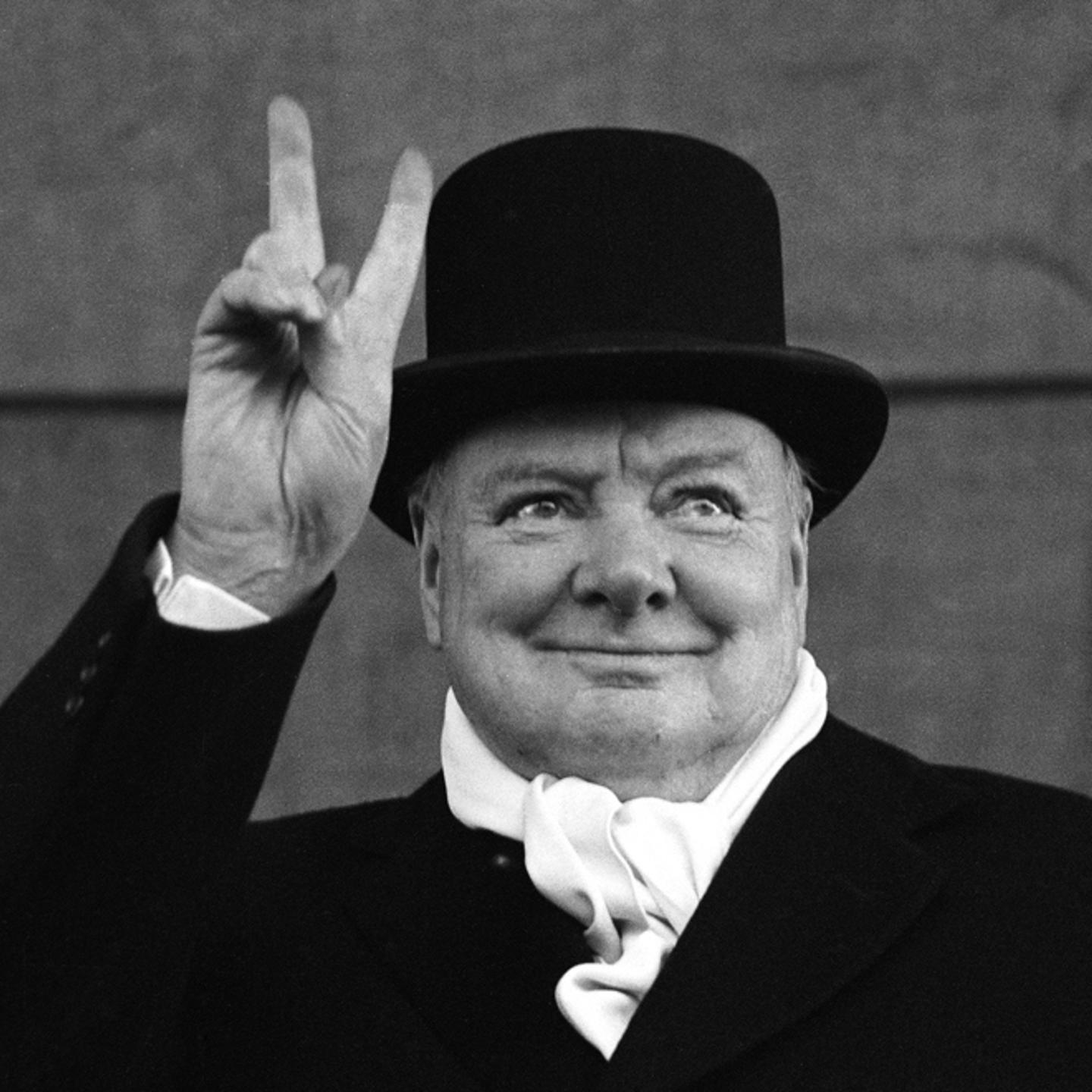 British Prime Minister Winston Churchill flashes his trademark "V for Victory" sign, 1951.