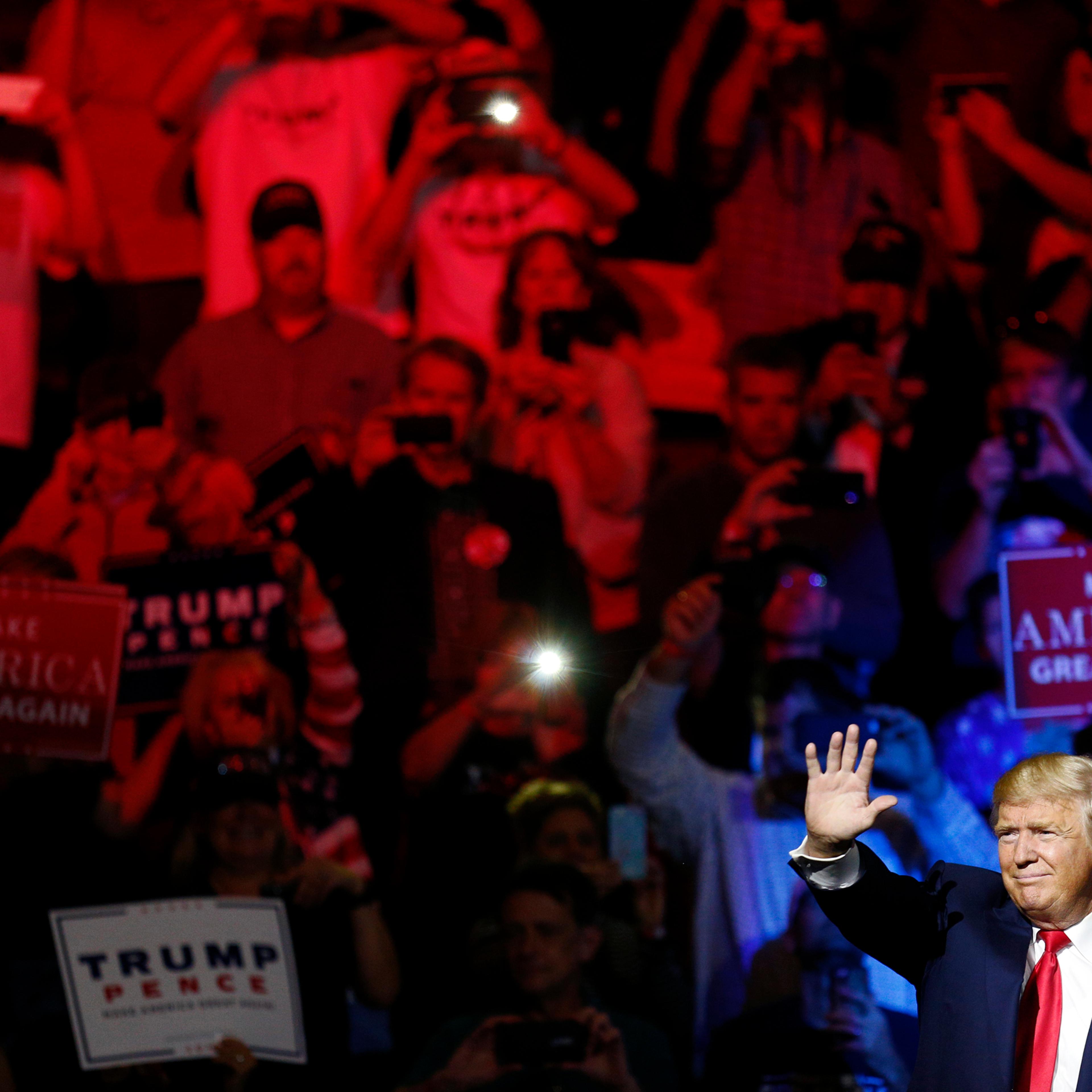 Donald Trump waves after speaking at a campaign event in Cincinnati, Ohio, on Oct. 13, 2016.