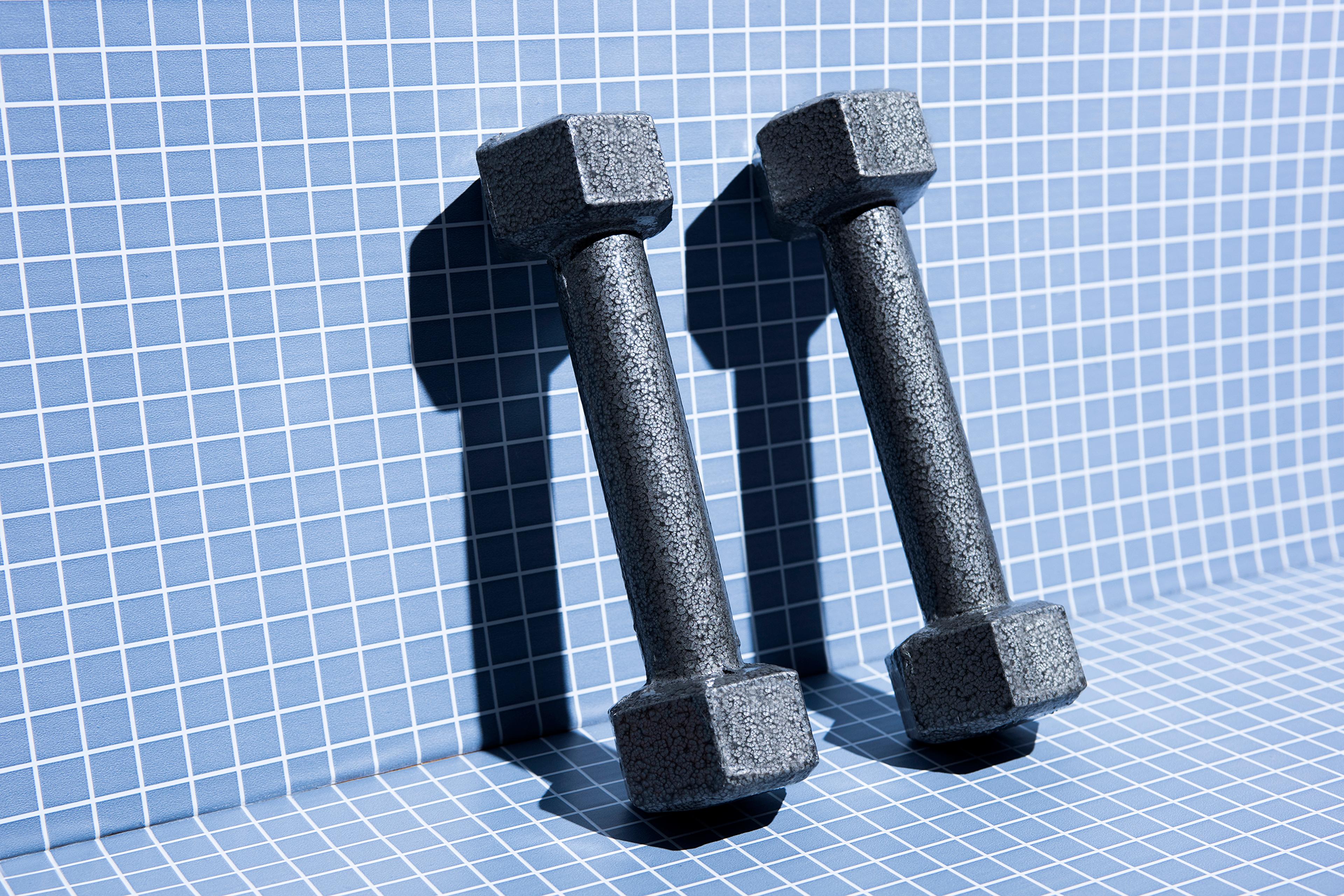 metal-weights-4-fitness-exercise-strength-health-betterment-body-image-motto-stock