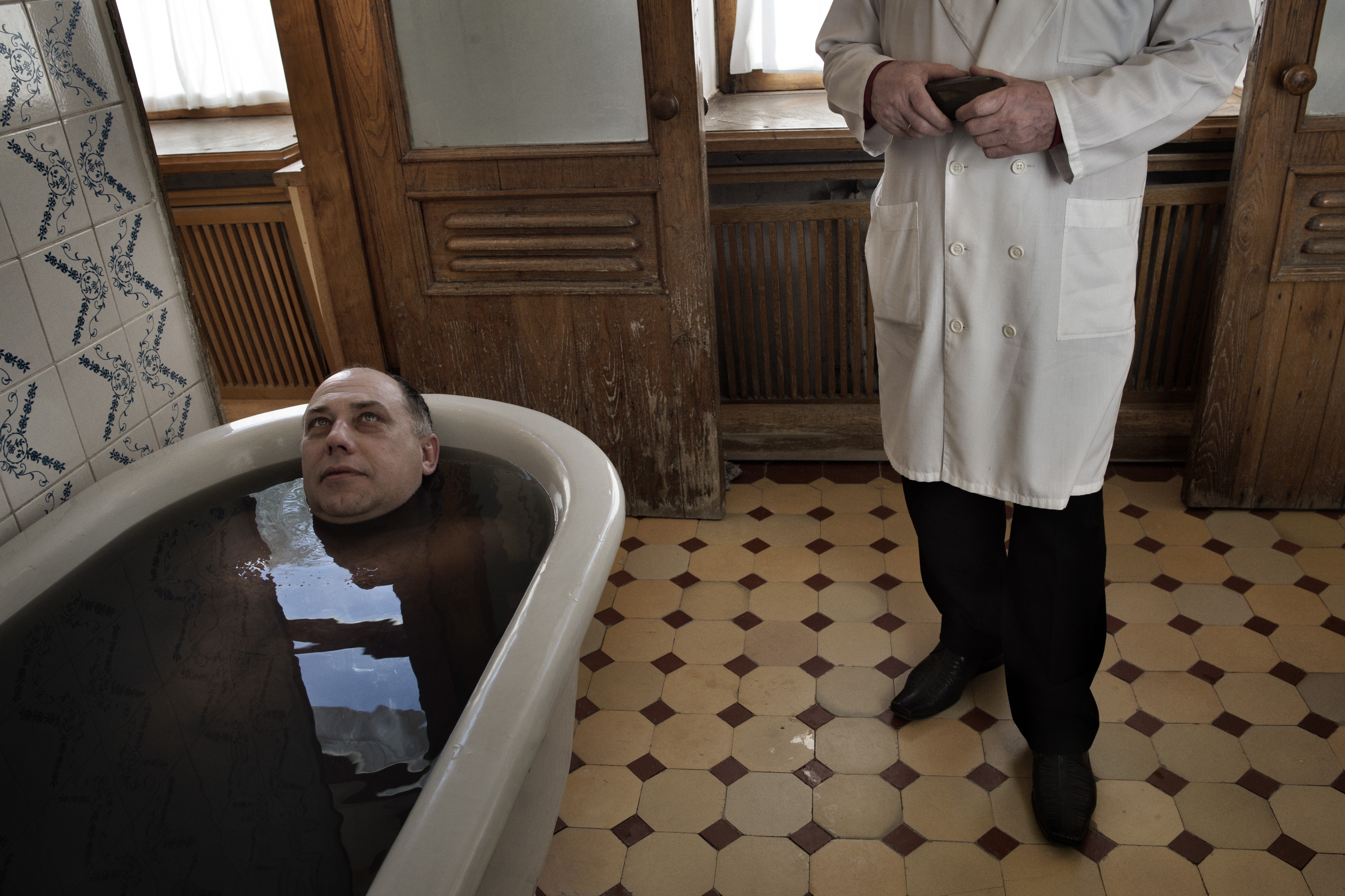 Sochi Russia January 15  2014 A patient during his mineral bath at the Matsesta Sanatorium in Sochi.  Starting in the late 1930s, Matsesta was at the center of Josef Stalin's drive to turn Sochi into the premier resort city of the Soviet Union. Workers f