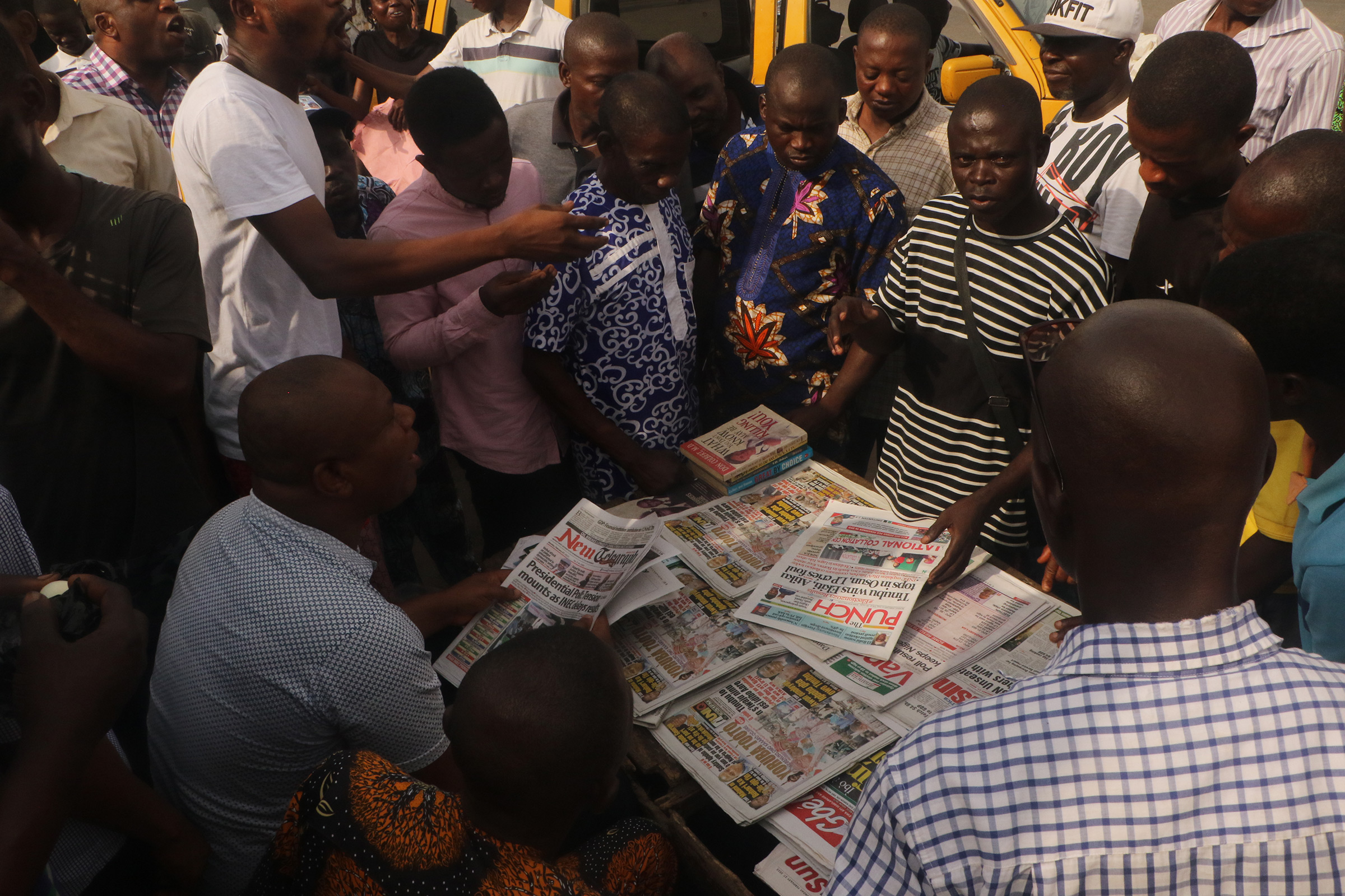 Nigerians in Lagos follow presidential election developments on Feb. 27. 