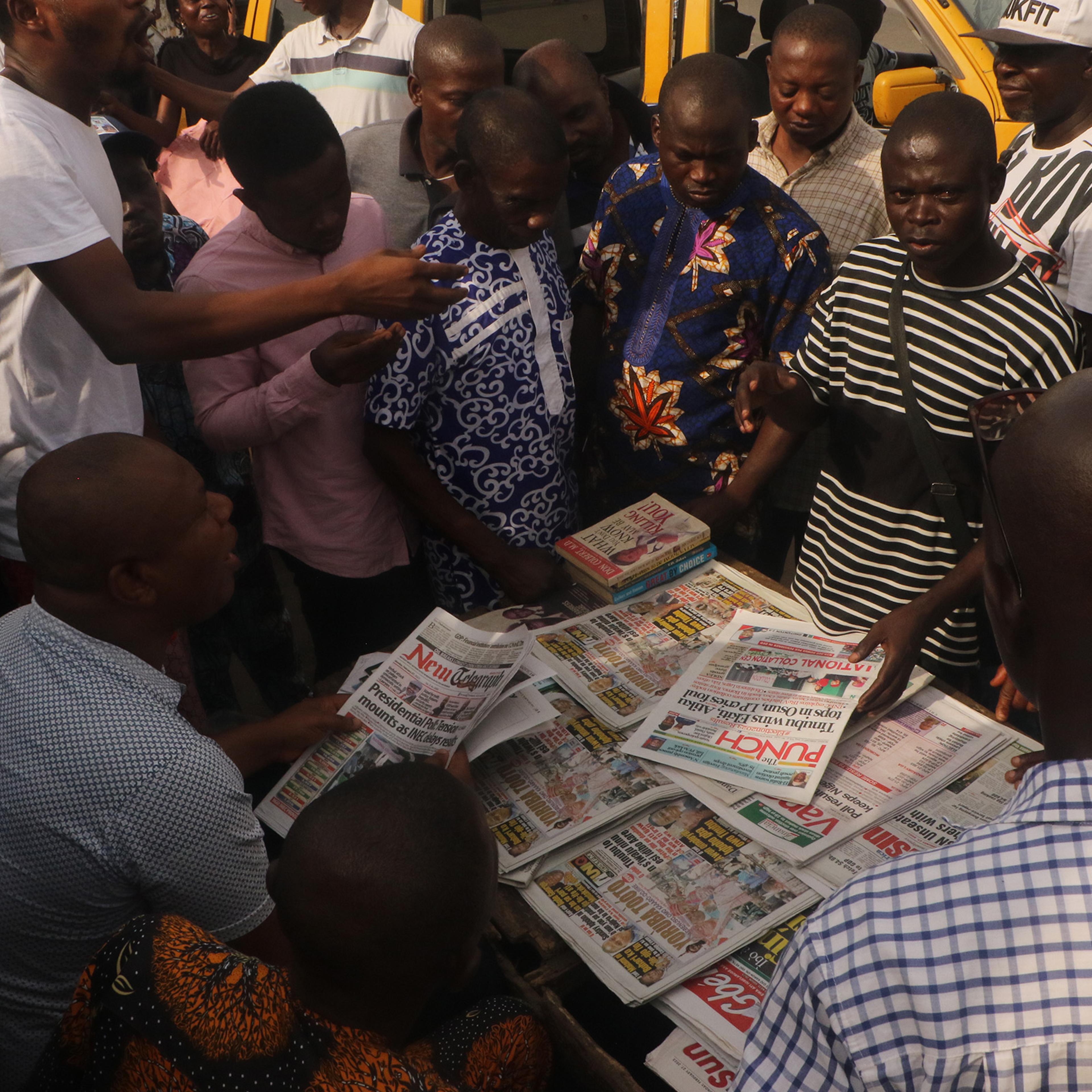 Nigerians in Lagos follow presidential election developments on Feb. 27.