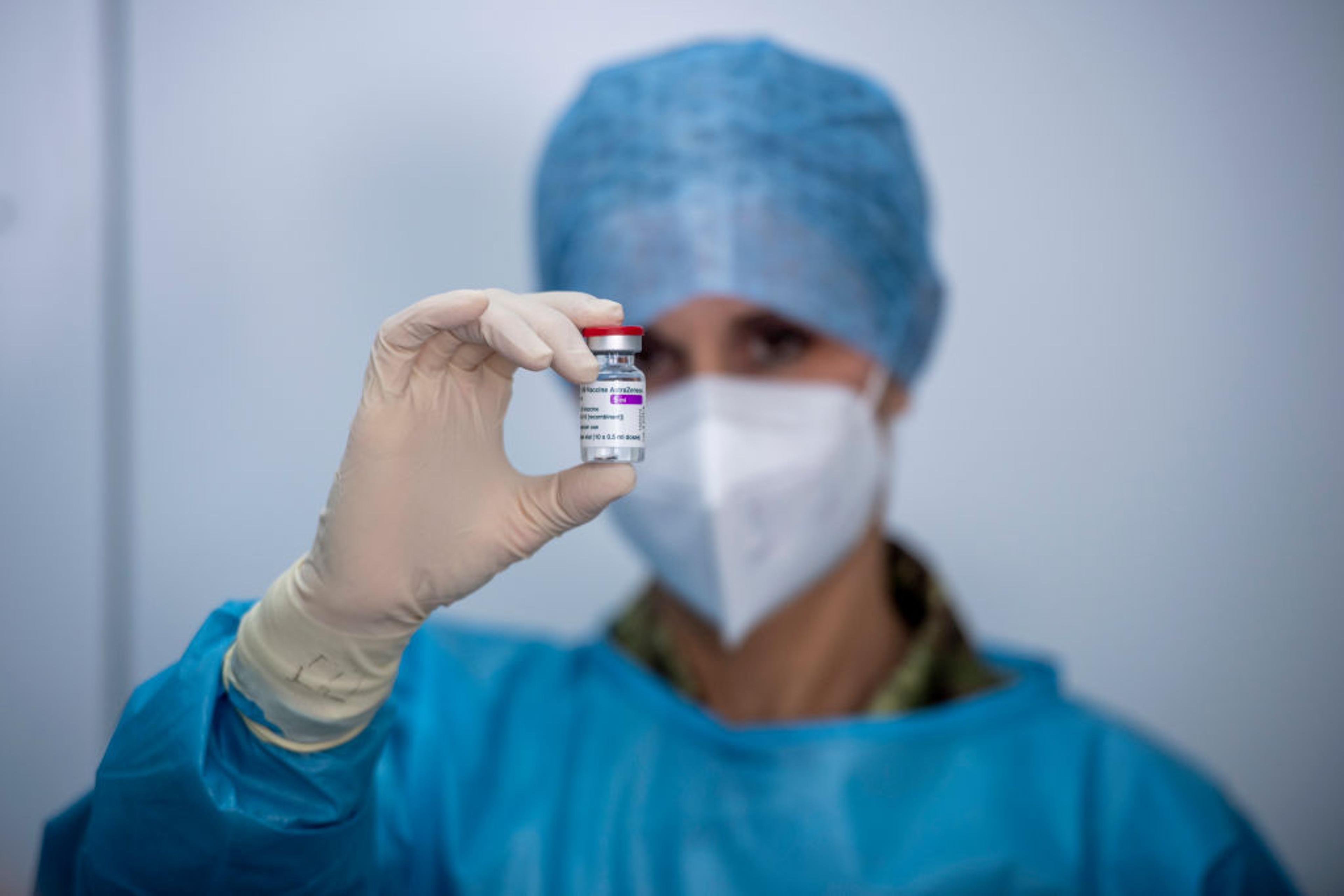 A healthcare worker of the Italian Army prepares doses of the AstraZeneca COVID-19 vaccine, as part of COVID-19 vaccinations plan for the military personnel, on February 23, 2021 in Rome, Italy.
