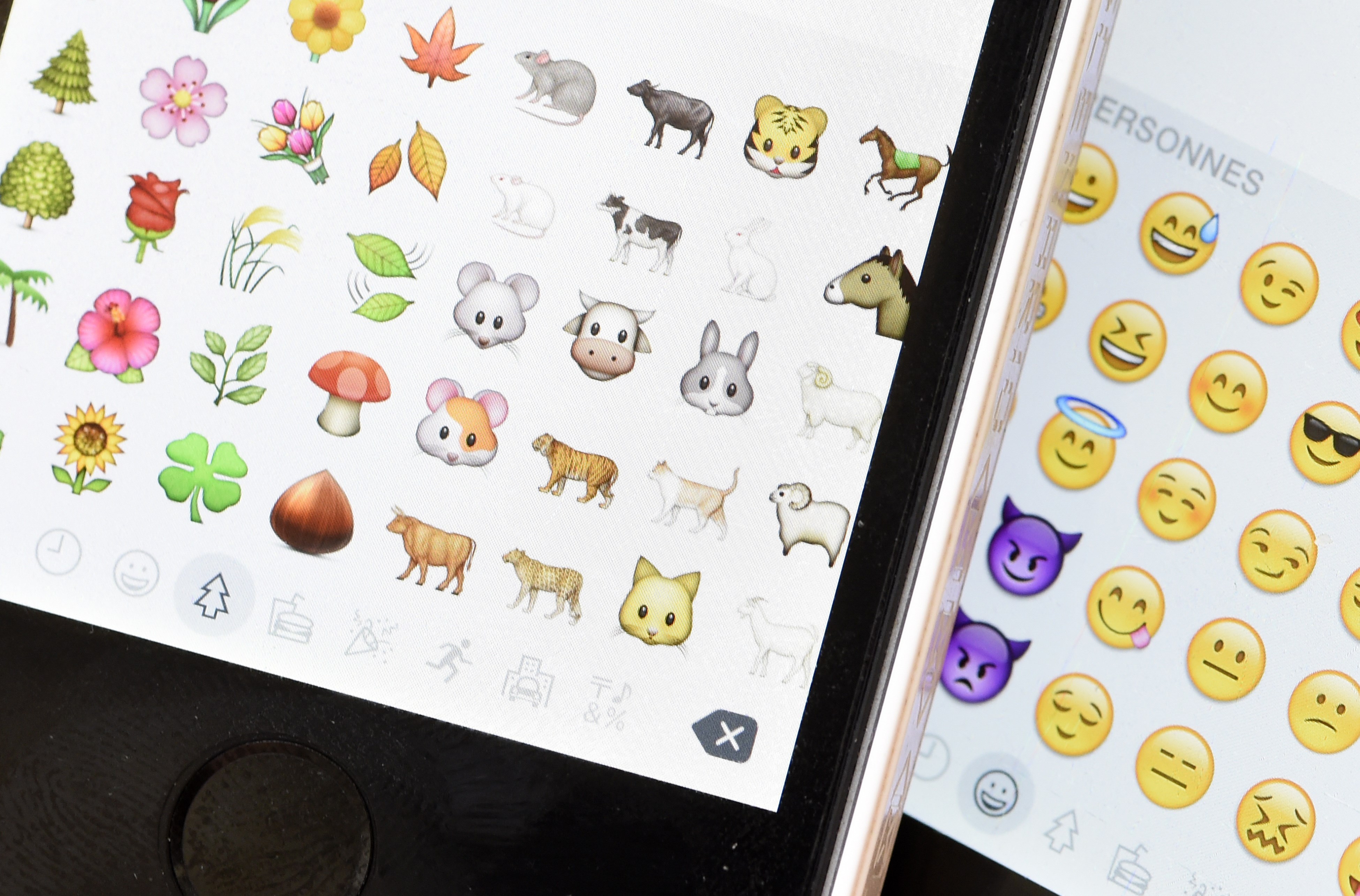 Emoji characters also known as emoticons on the screens of two mobile phones in Paris on Aug. 6, 2015.