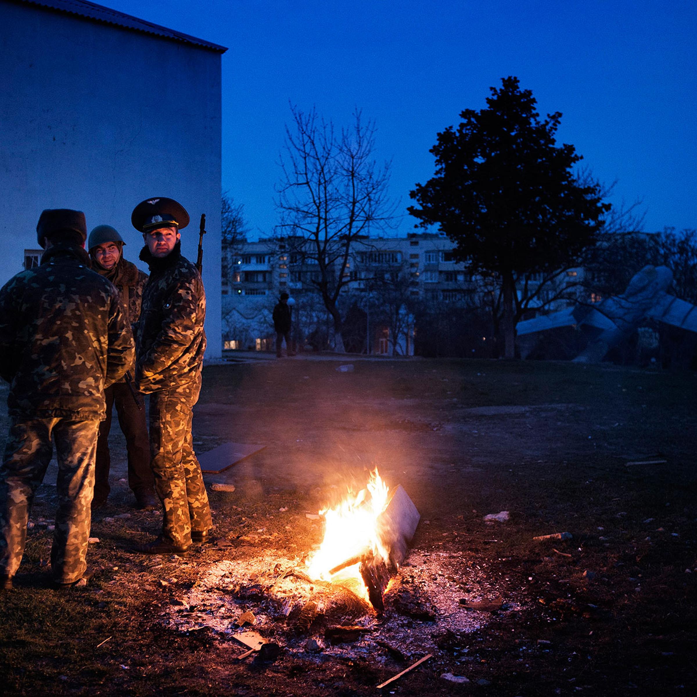 Ukrainian officers guard Belbek air base