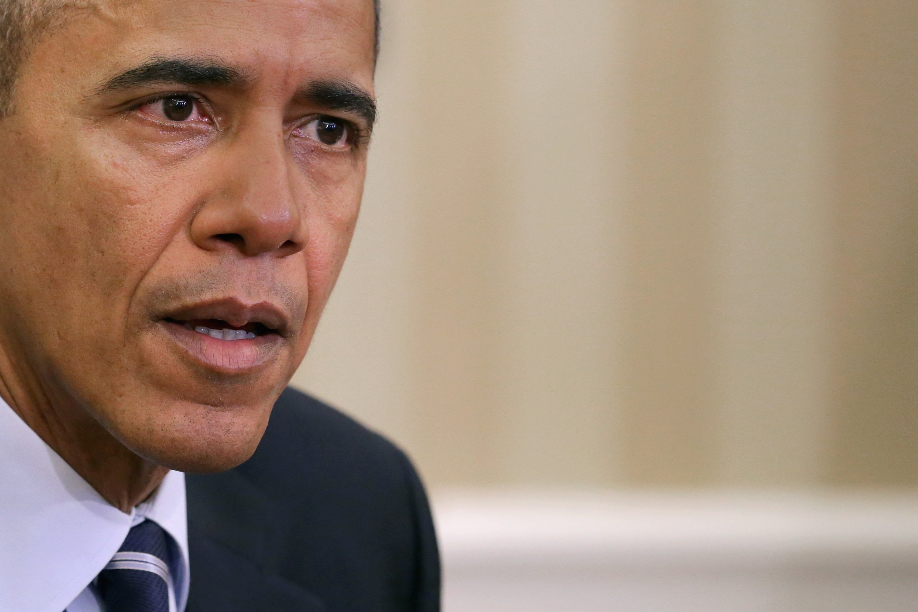President Barack Obama delivers a statement to the news media after receiving a briefing from his national security team in the Oval Office at the White House in Washington, DC on Dec. 3, 2015.