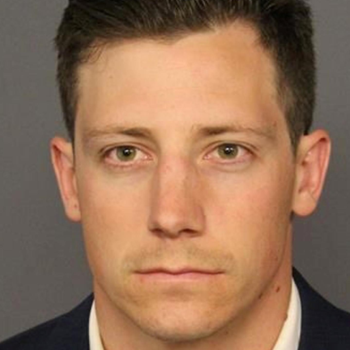 FBI agent Bishop appears in a booking photo in Denver