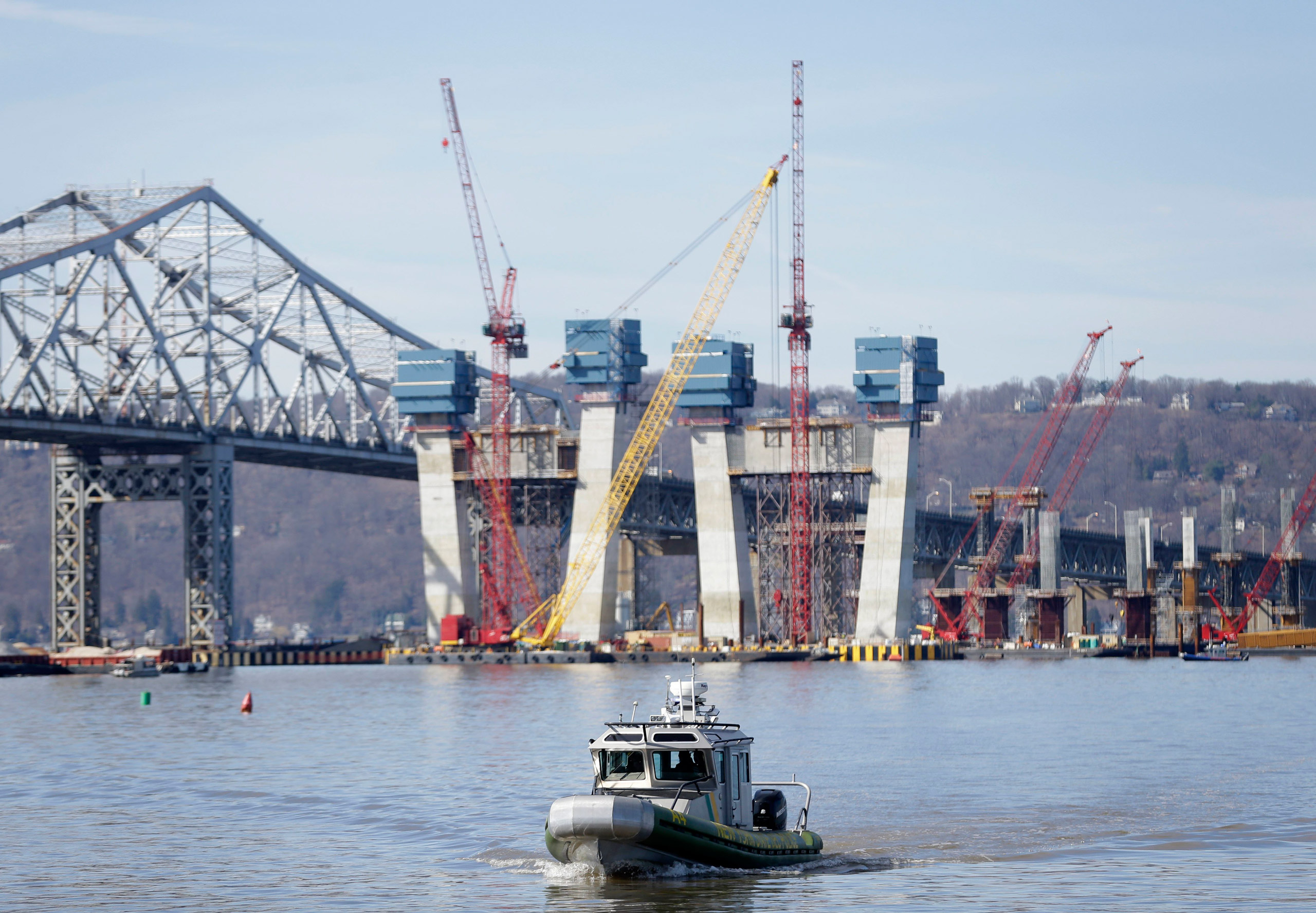 A New York State Police boat passes near the site of a fatal collision in the water underneath the Tappan Zee Bridge in Tarrytown, N.Y., Saturday, March 12, 2016. A tugboat crashed into a barge on the Hudson River north of New York City early Saturday ki