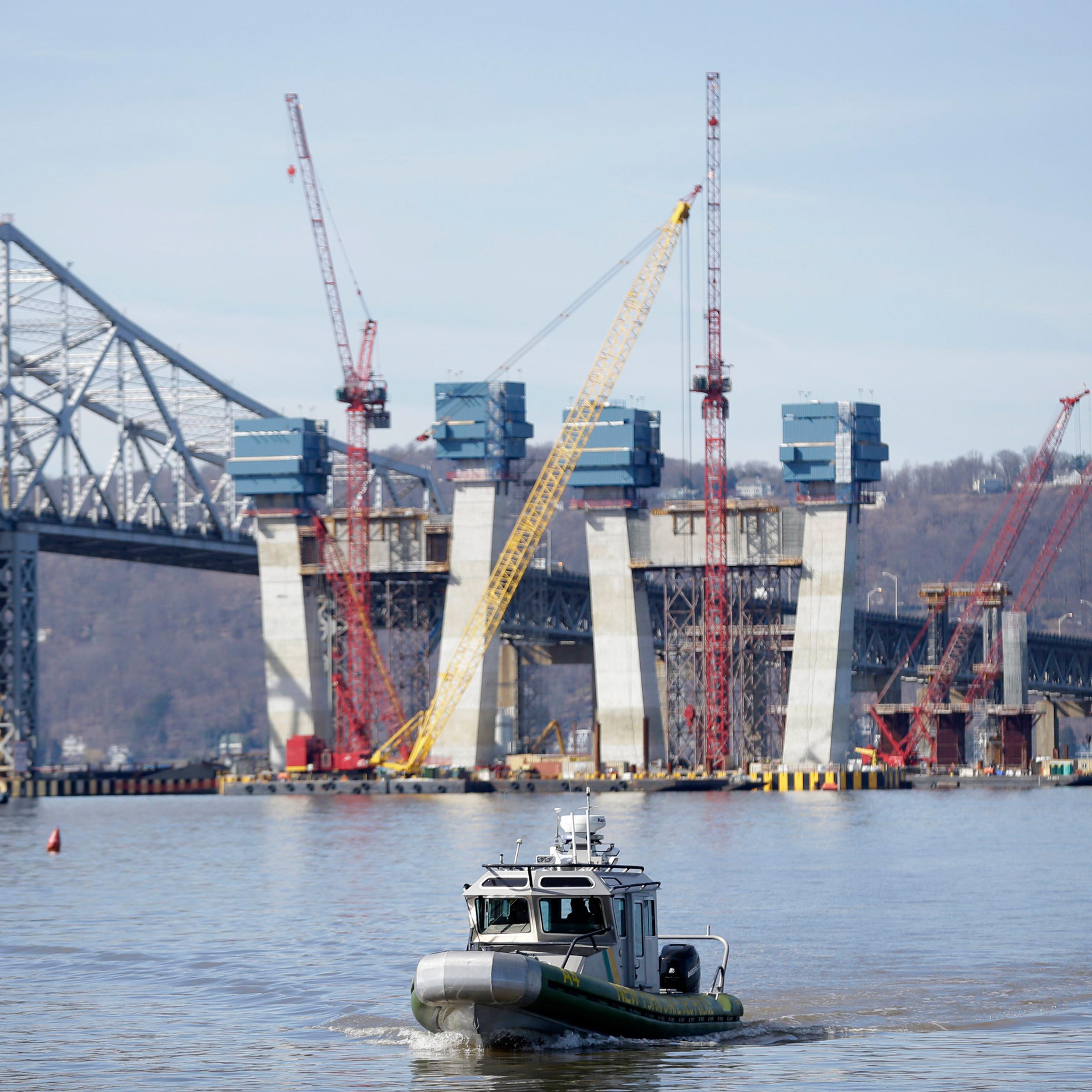 A New York State Police boat passes near the site of a fatal collision in the water underneath the Tappan Zee Bridge in Tarrytown, N.Y., Saturday, March 12, 2016. A tugboat crashed into a barge on the Hudson River north of New York City early Saturday ki