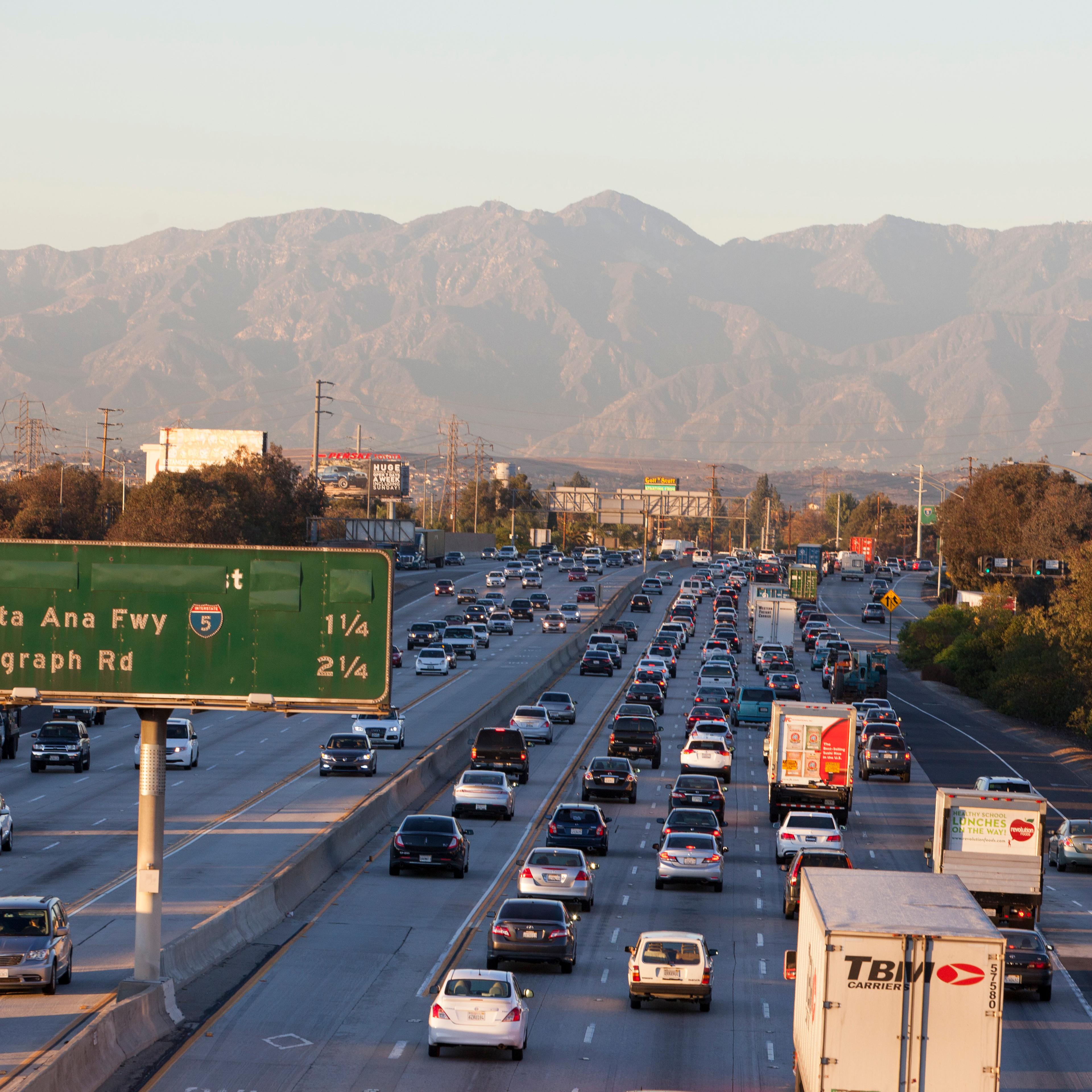 The 605 freeway is jammed with cars on a day when the mountains are visible in the distance, on November 5, 2014 in Los Angeles, California.