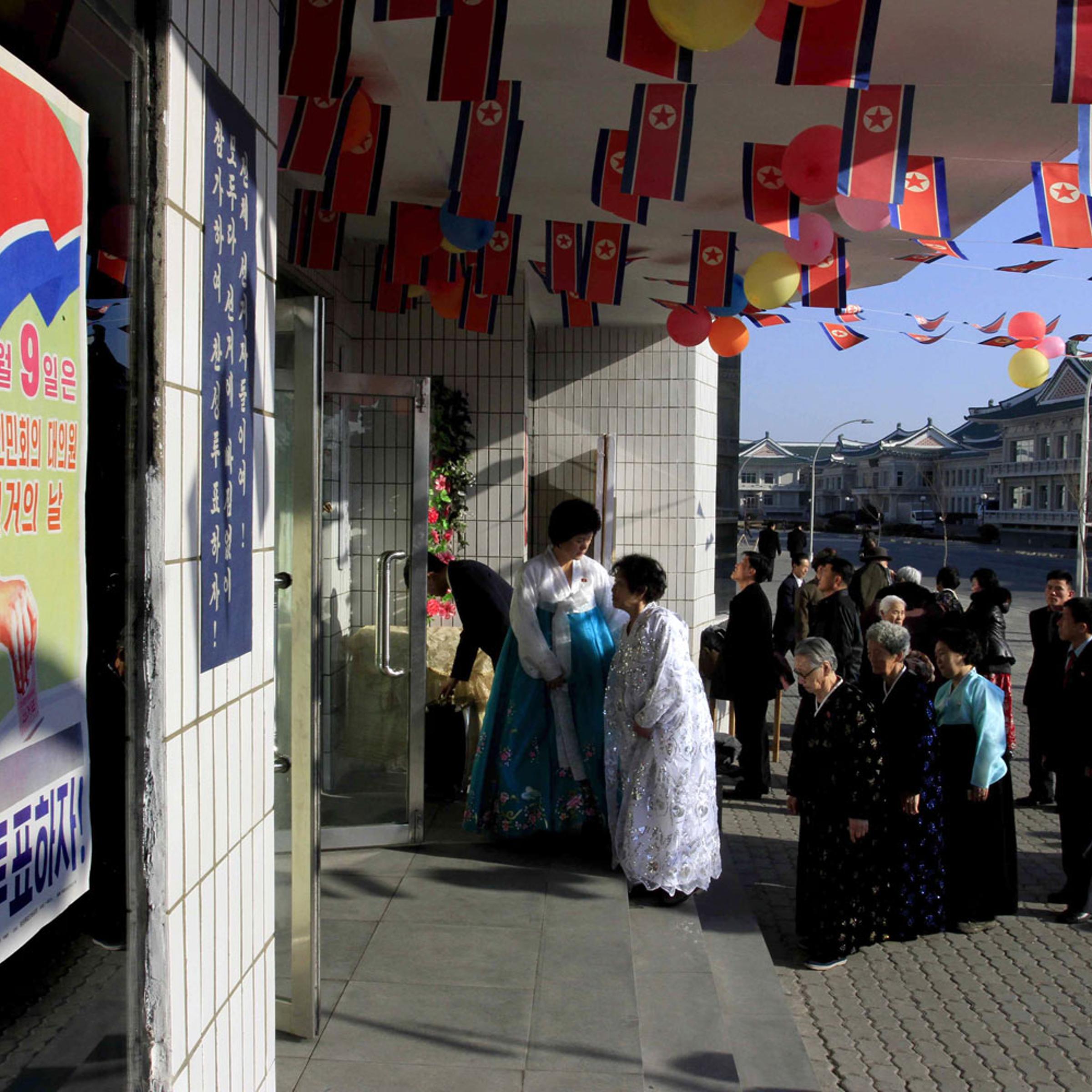North Korean voters line up to cast their ballots to elect deputies for the Supreme People's Assembly in Pyongyang on March 9, 2014