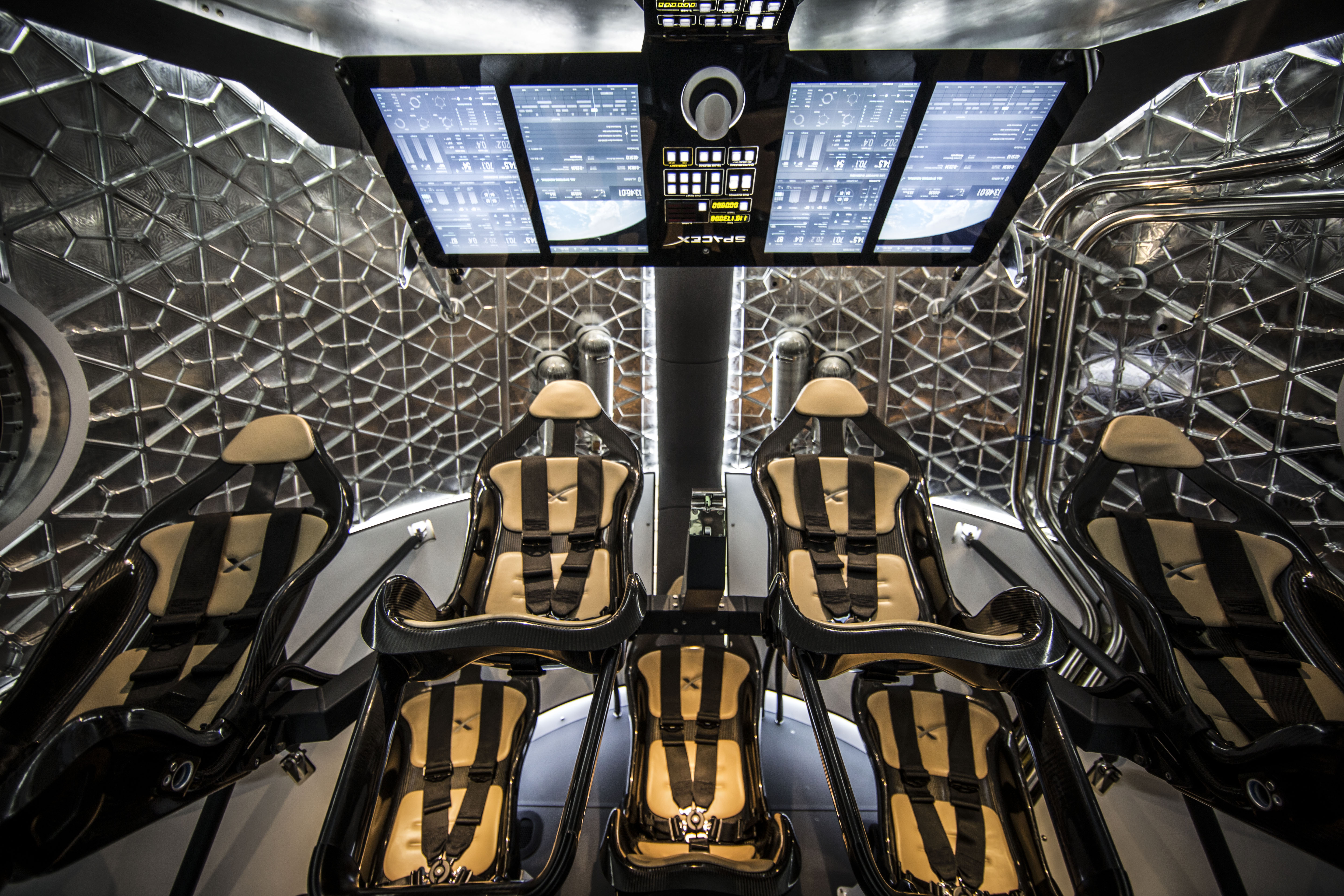 Sweet ride: The interior of SpaceX's Dragon spacecraft. For the first moon mission only two seats would be filled.