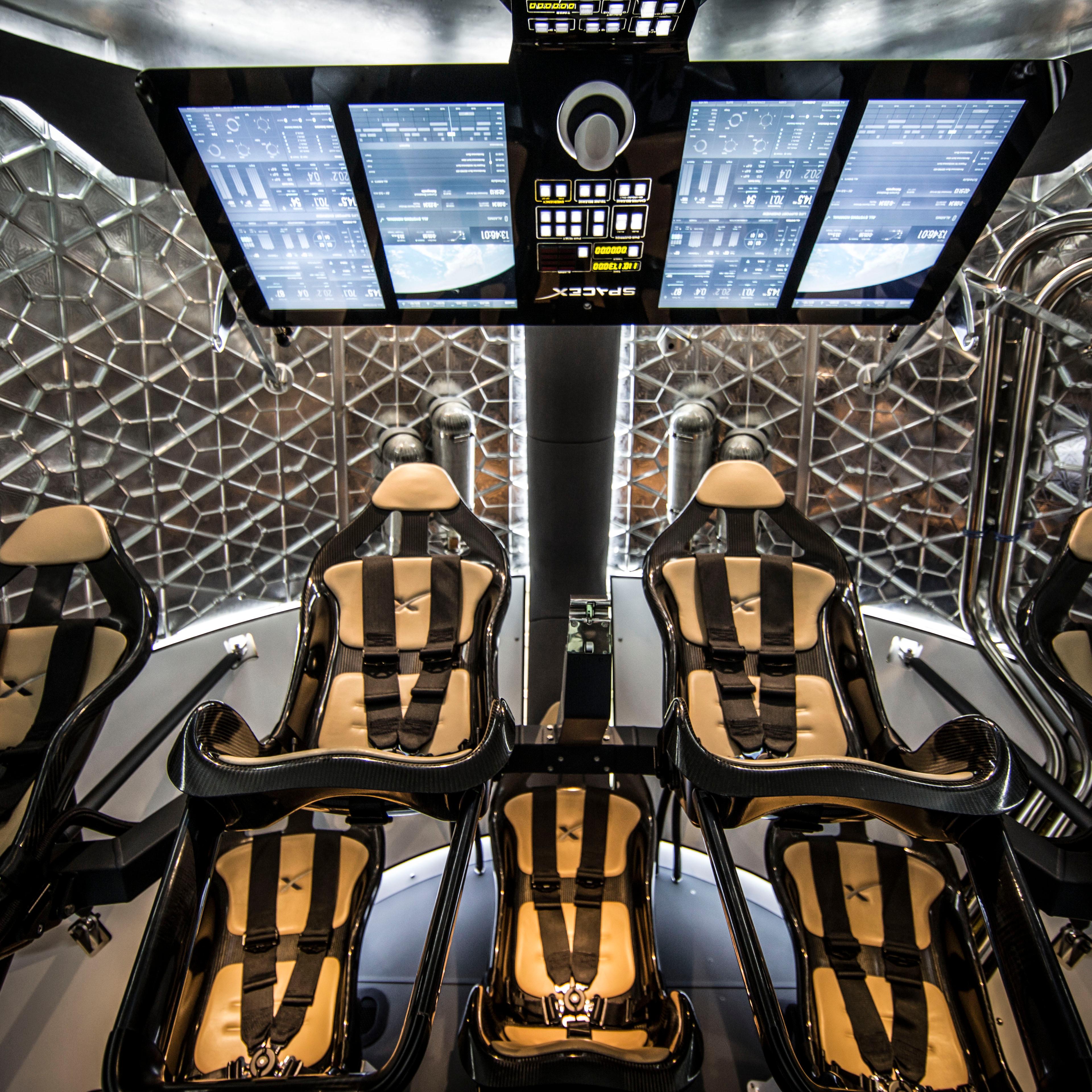 Sweet ride: The interior of SpaceX's Dragon spacecraft. For the first moon mission only two seats would be filled.