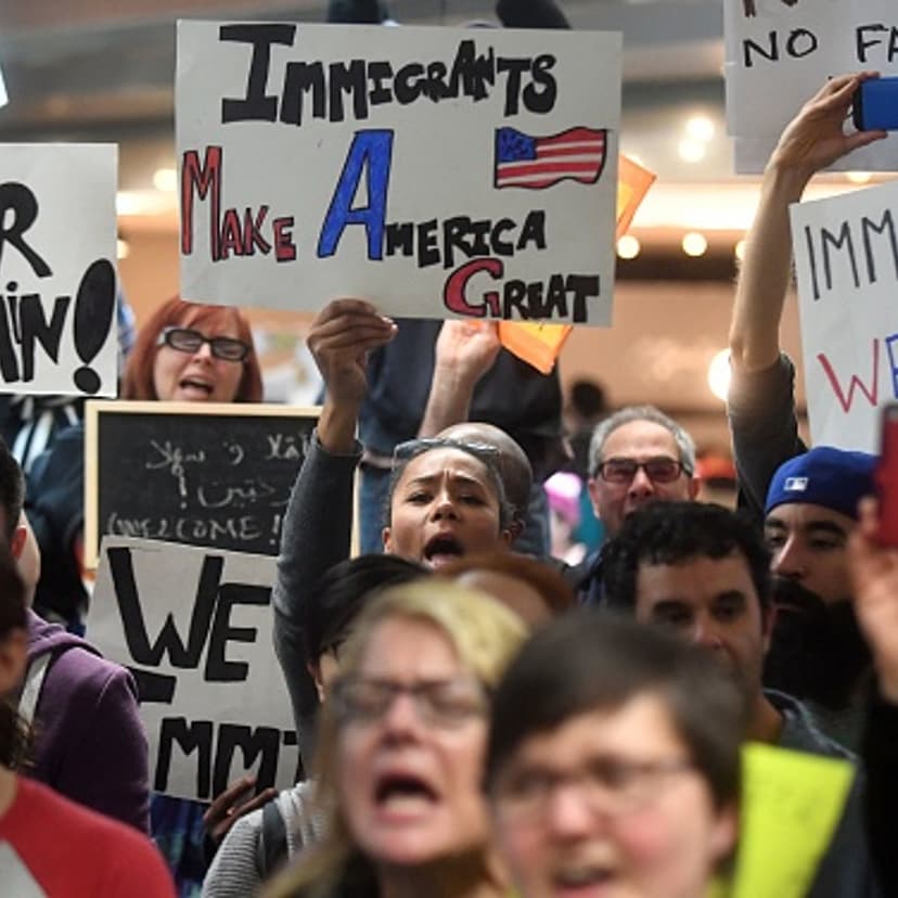 Protesters shout and hold up signs at San Francisco International Airport in San Francisco, California on January 29, 2017.