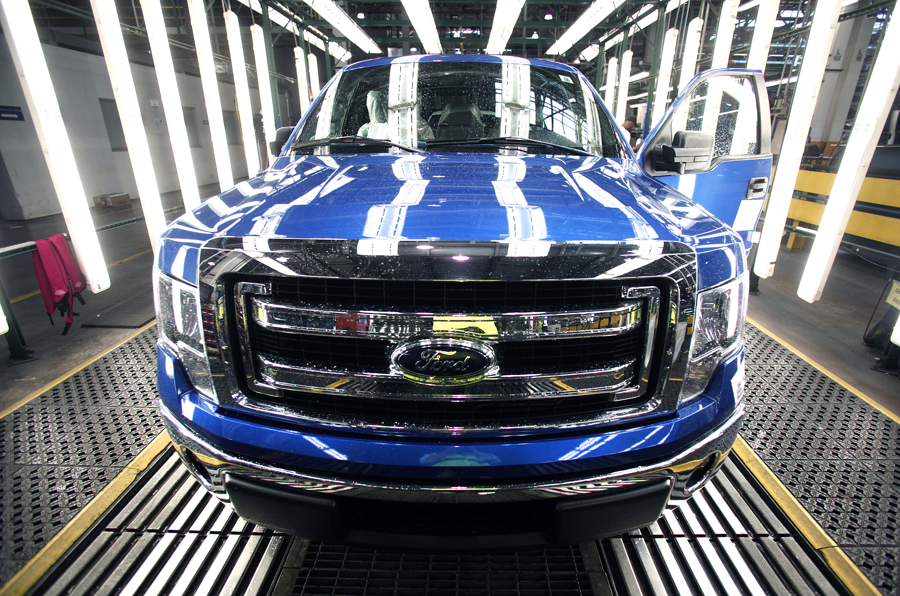A new 2014 Ford F-150 truck exits a quality control inspection after undergoing assembly at the Ford Dearborn Truck Plant on June 13, 2014 in Dearborn, Mich.
