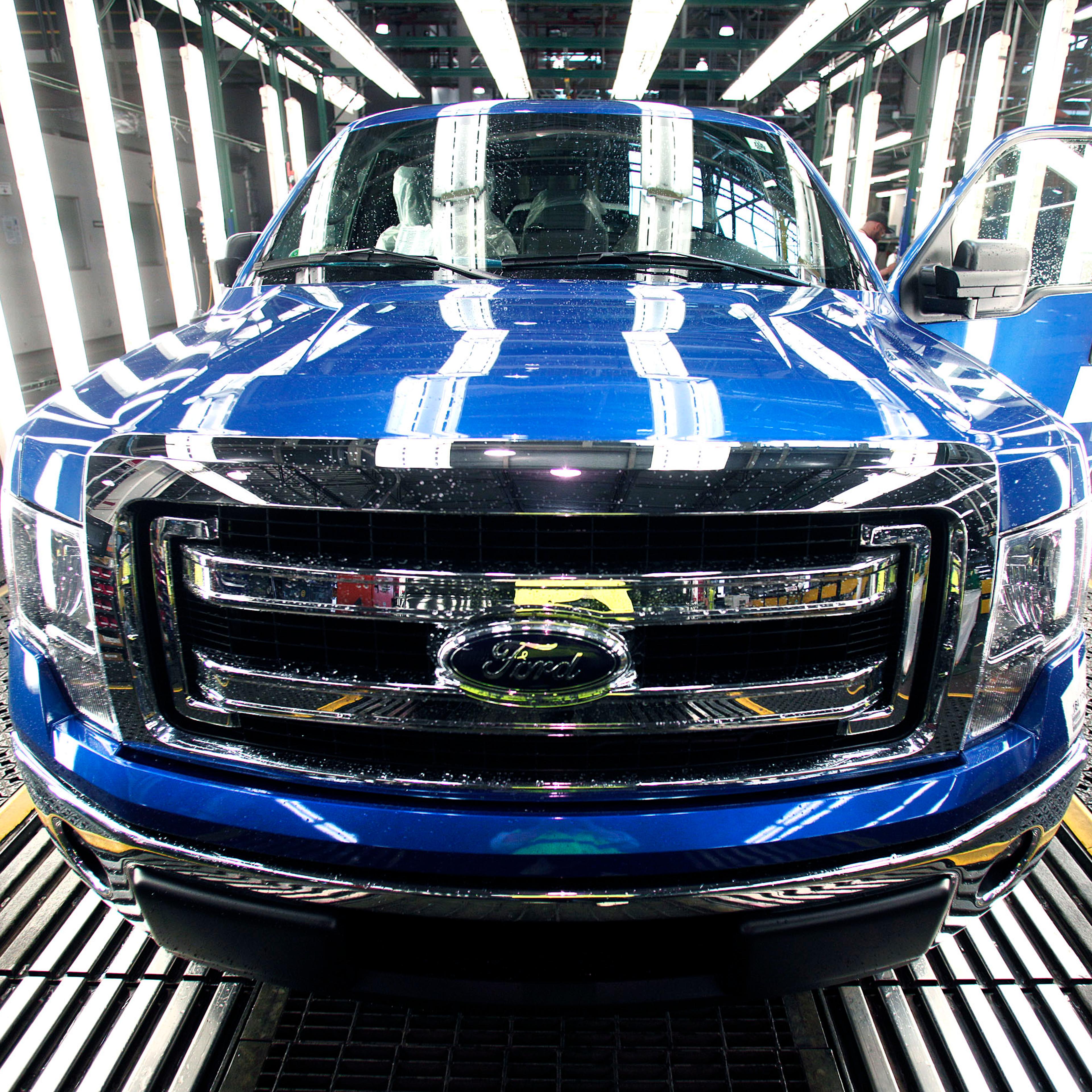 A new 2014 Ford F-150 truck exits a quality control inspection after undergoing assembly at the Ford Dearborn Truck Plant on June 13, 2014 in Dearborn, Mich.