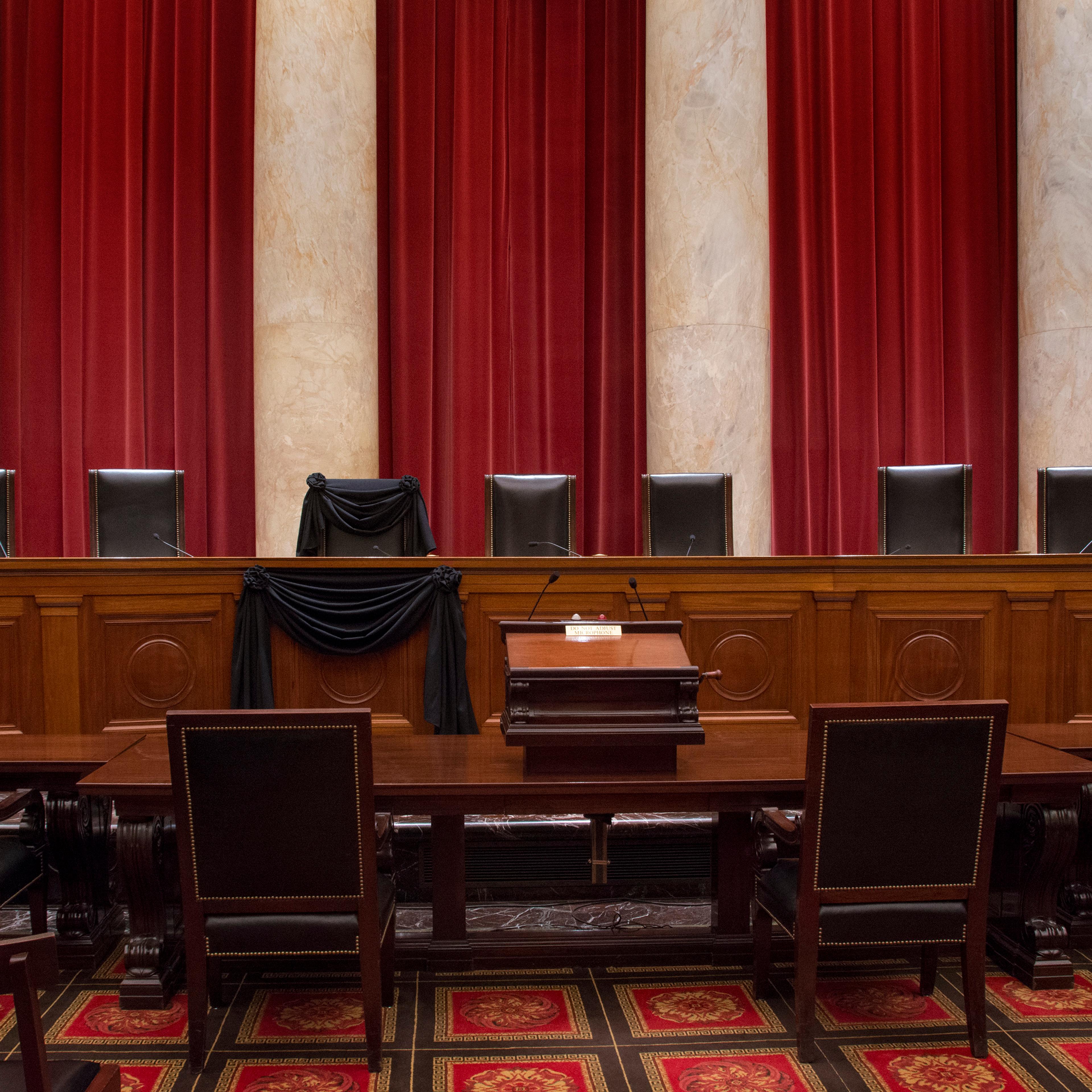 Associate Justice Antonin Scalia’s bench chair and the bench in front of his seat are draped in black in the Courtroom of the Supreme Court following his Feb. 13, 2016 death.