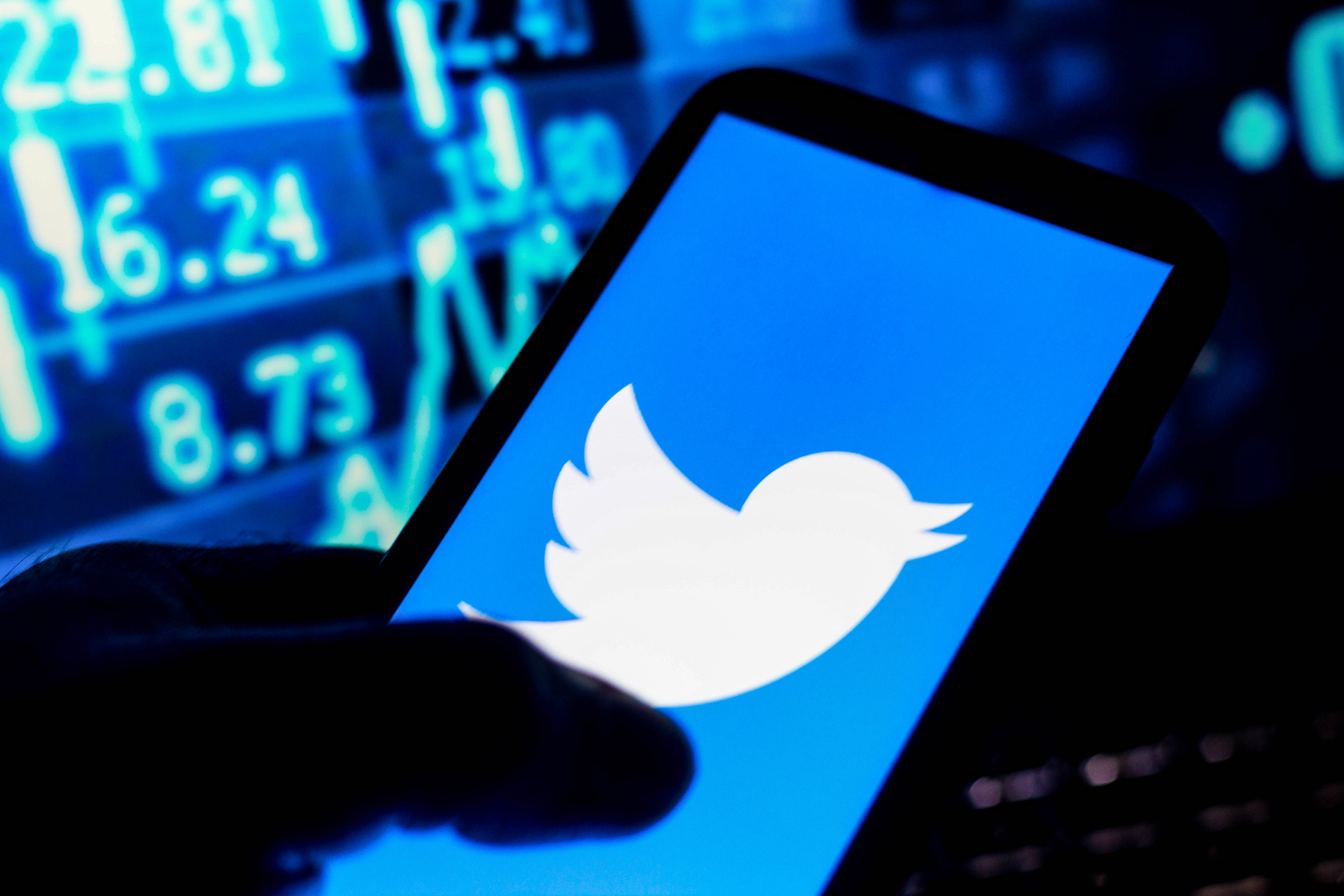 In this photo illustration the Twitter logo seen displayed