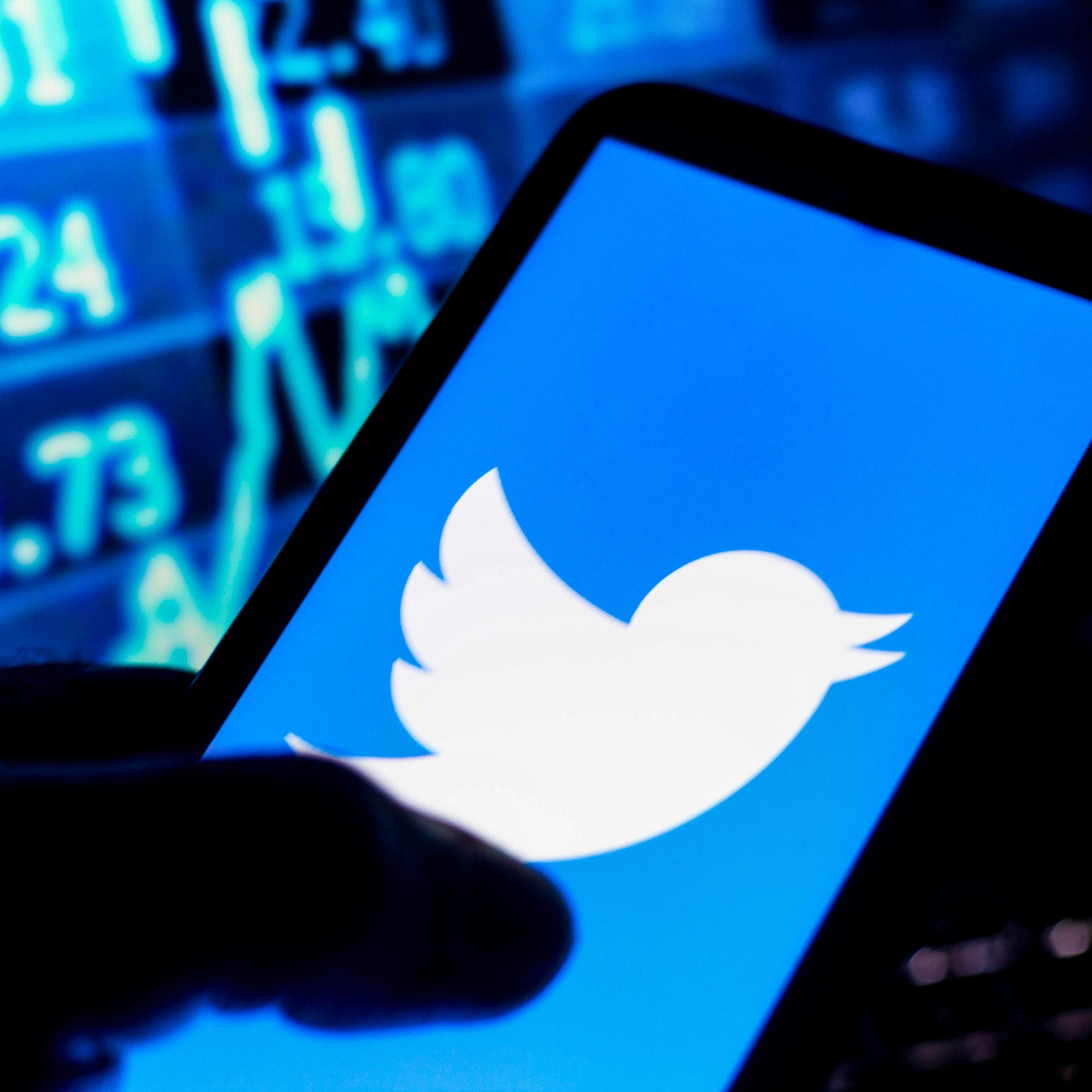 In this photo illustration the Twitter logo seen displayed