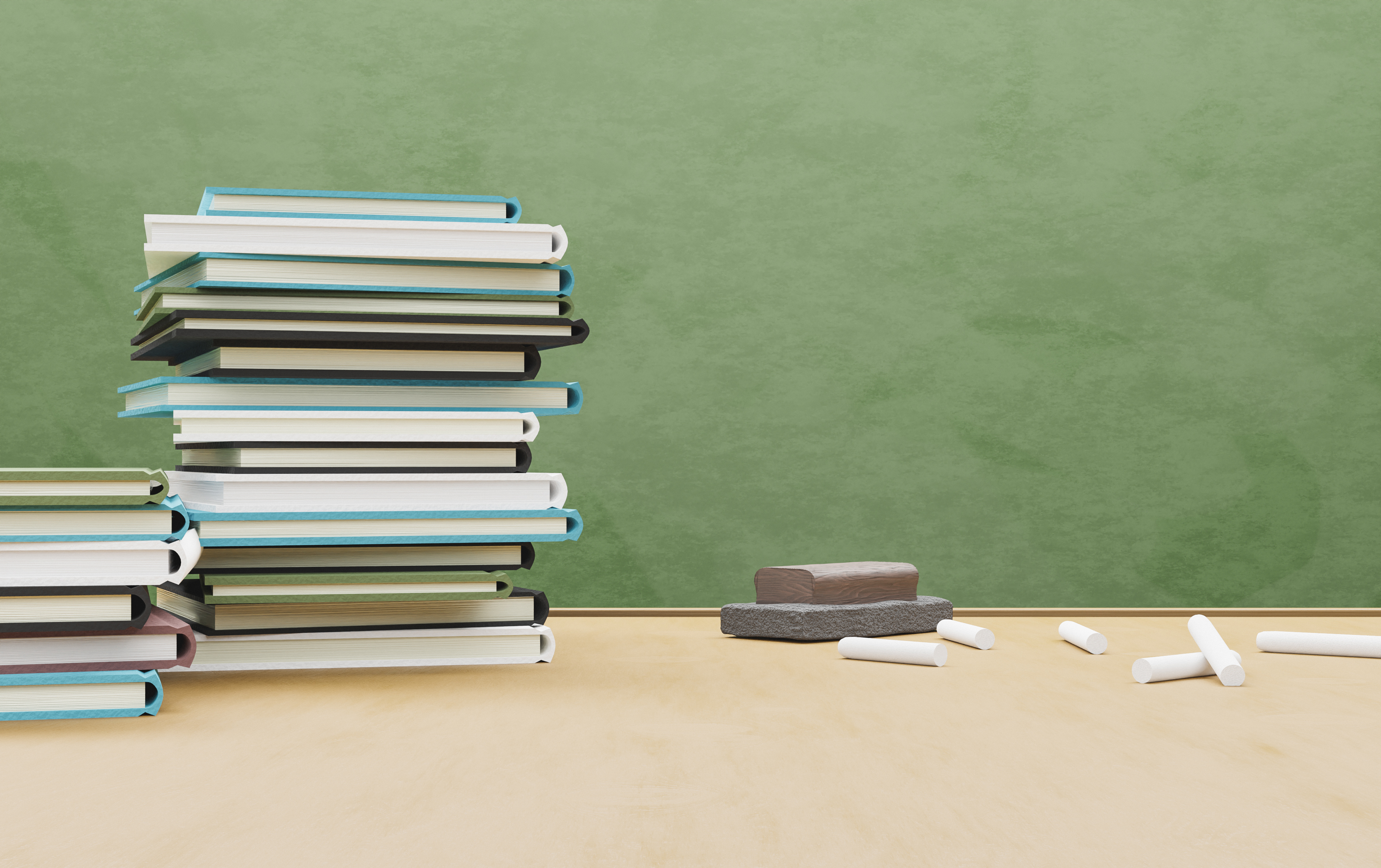 School table full of books with eraser and chalk,Romania