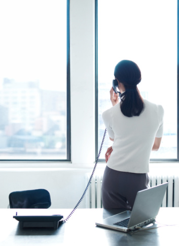 business-woman-phone-rear-view