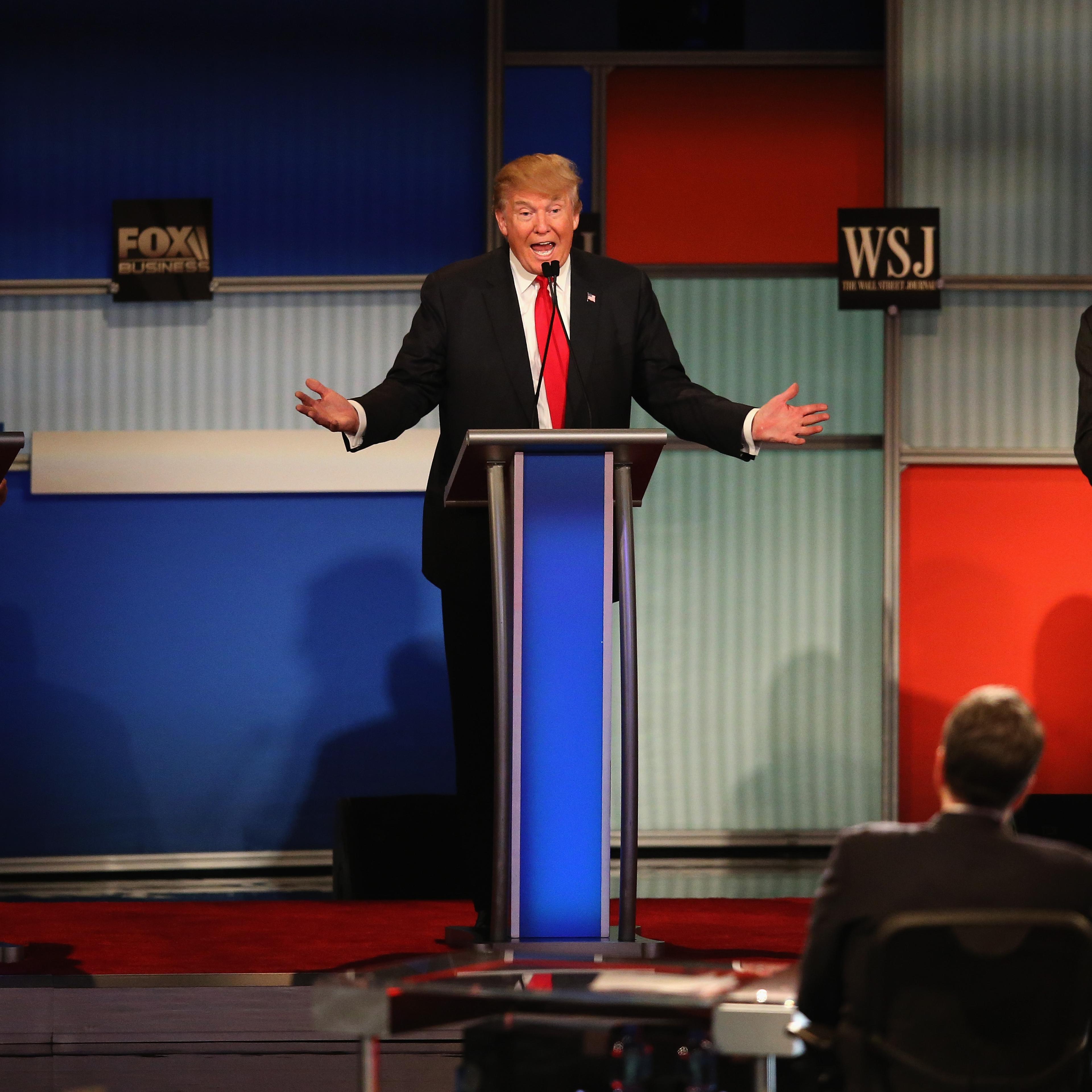 Presidential candidate Donald Trump (C) speaks while Sen. Marco Rubio (L) (R-FL), and Ben Carson look on during the Republican Presidential Debate sponsored by Fox Business and the Wall Street Journal in Milwaukee, Wisc., on Nov. 10, 2015.