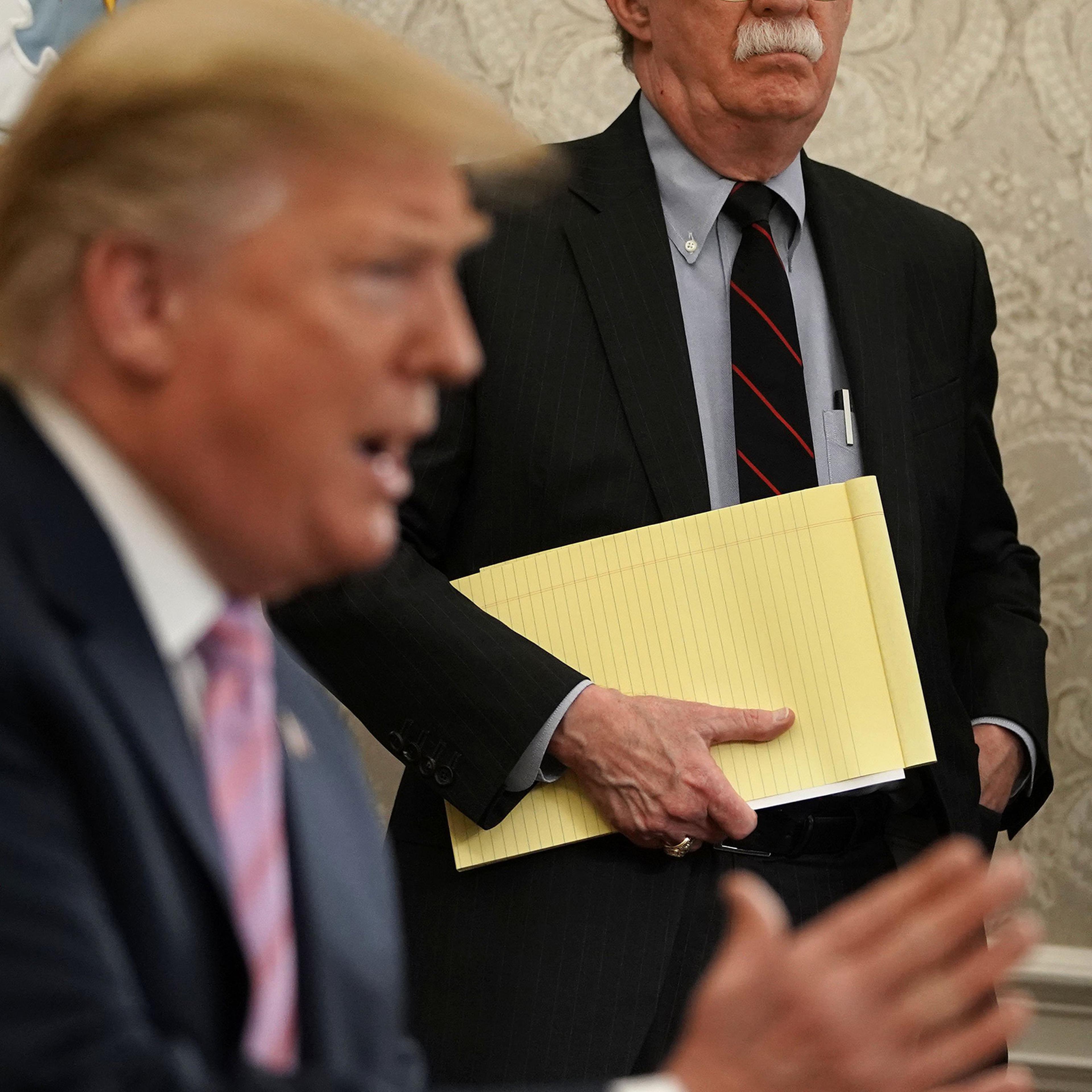 John Bolton, then National Security Advisor, listens to President Trump during an Oval Office meeting on April 9, 2019