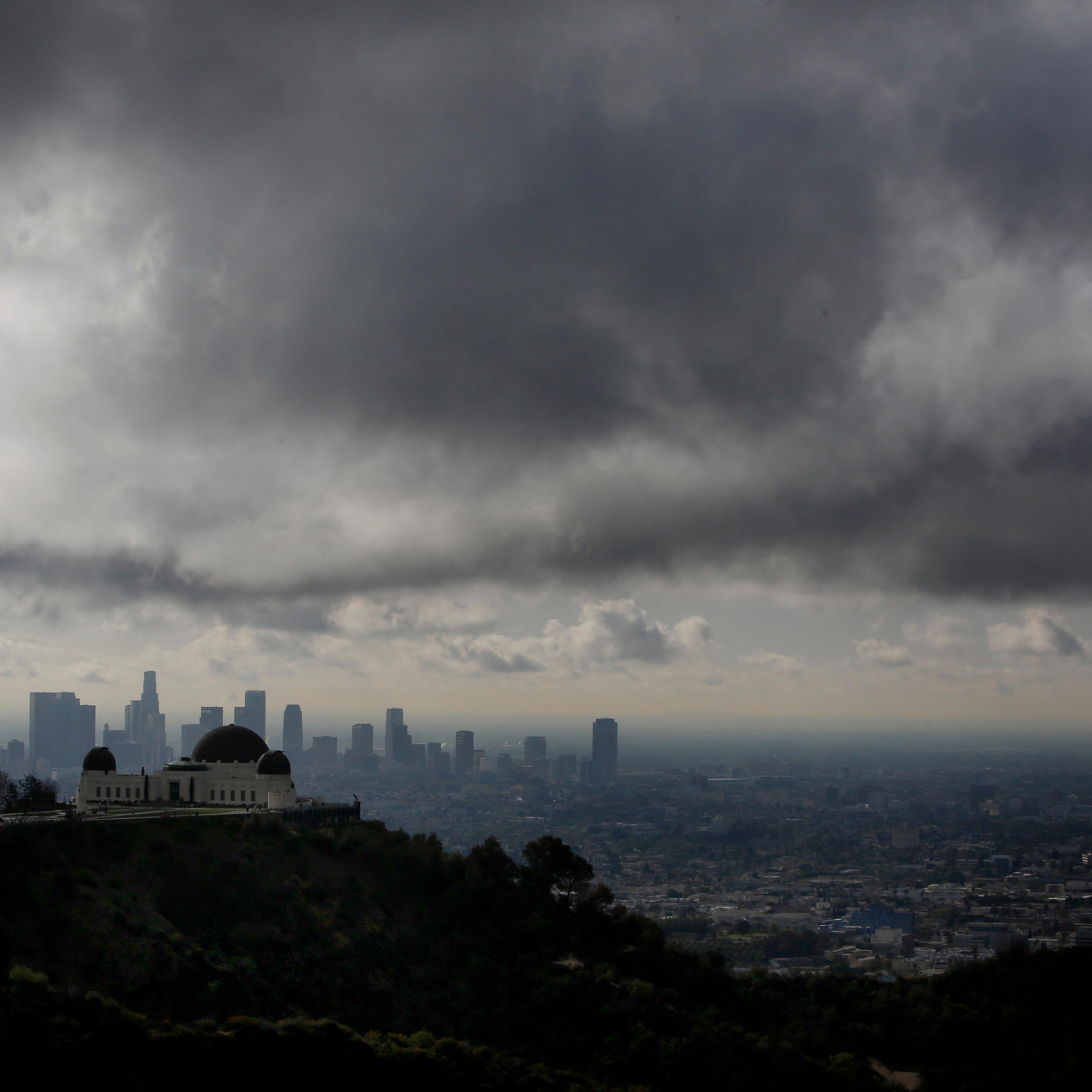 The Griffith Observatory is seen as clouds gather above the skyline of Downtown Los Angeles in Los Angeles, California, U.S., on Thursday, Feb. 27, 2014.