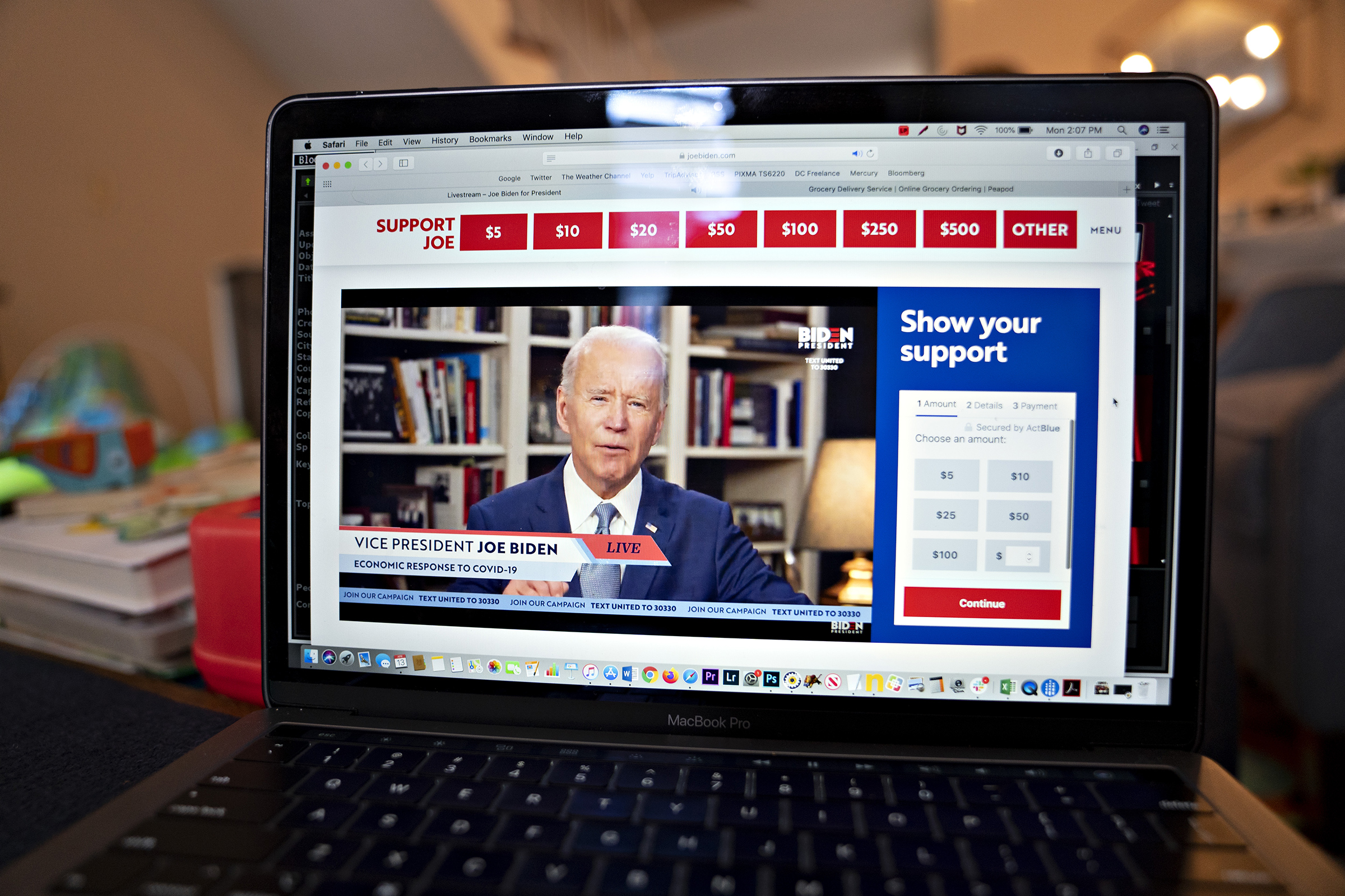 Former Vice President Joe Biden, presumptive Democratic presidential nominee, speaks during a virtual event seen on an Apple Inc. laptop computer in Arlington, Virginia, on April 13