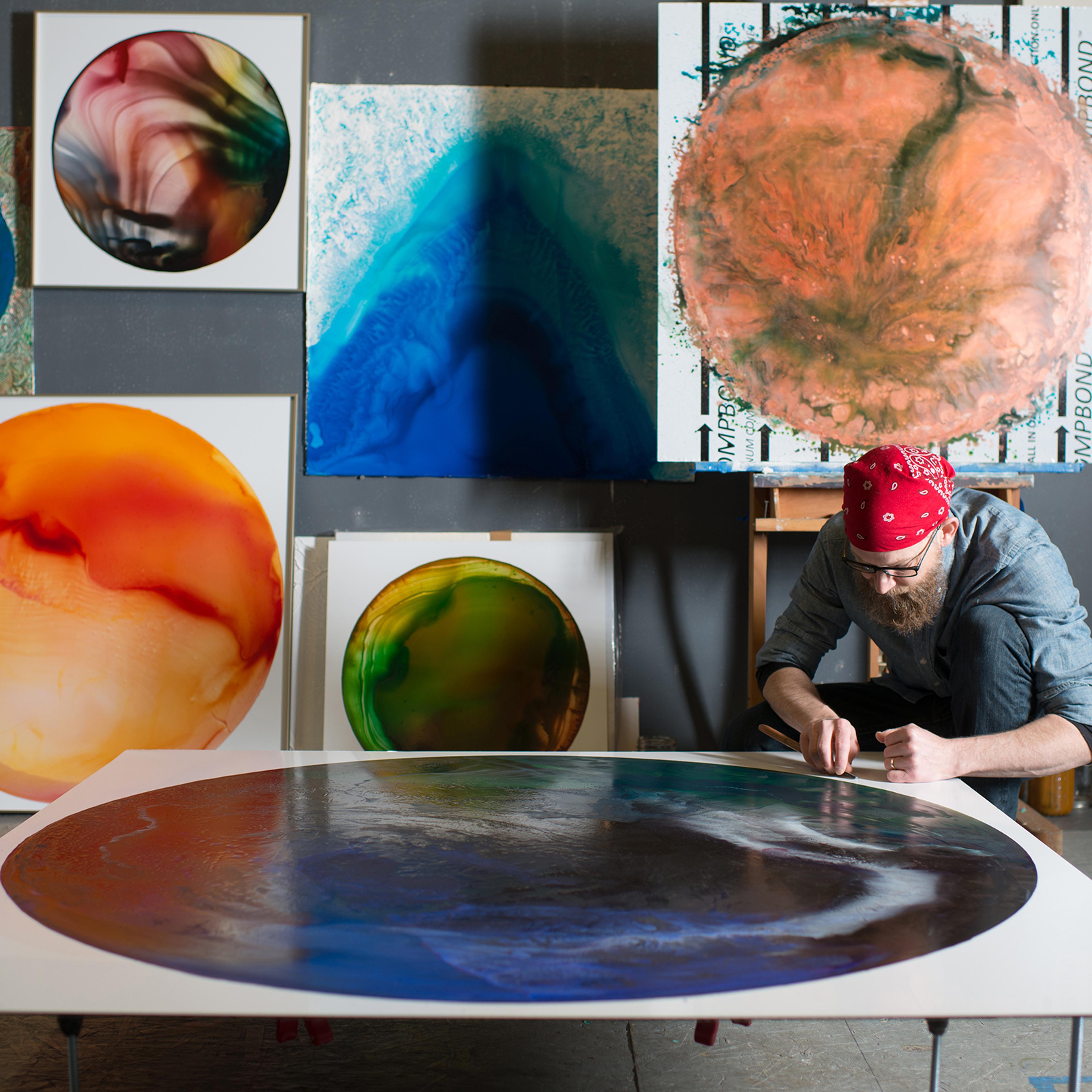 John Sabraw painting in his studio, in Athens, Ohio in 2018.