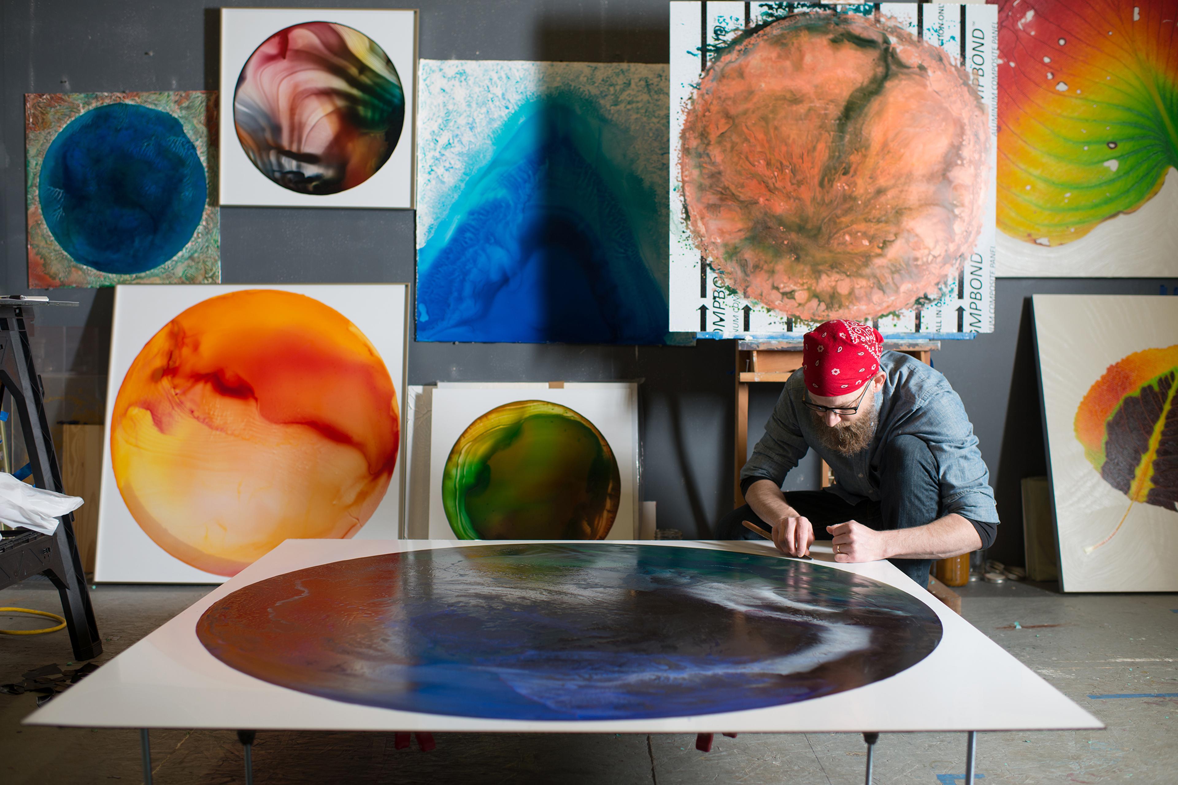John Sabraw painting in his studio, in Athens, Ohio in 2018.